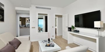 a living room with a television and a couch