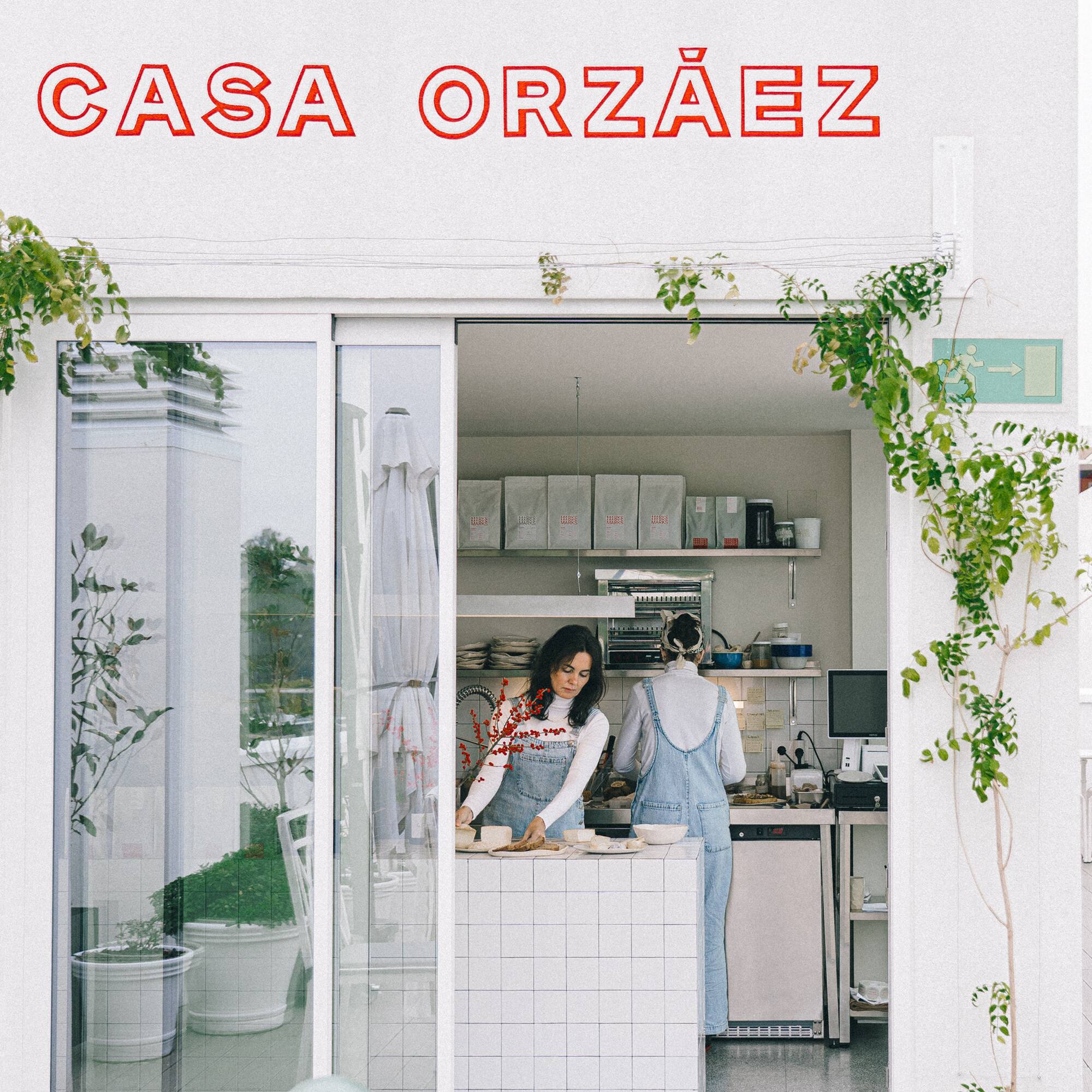 a woman standing in front of a store