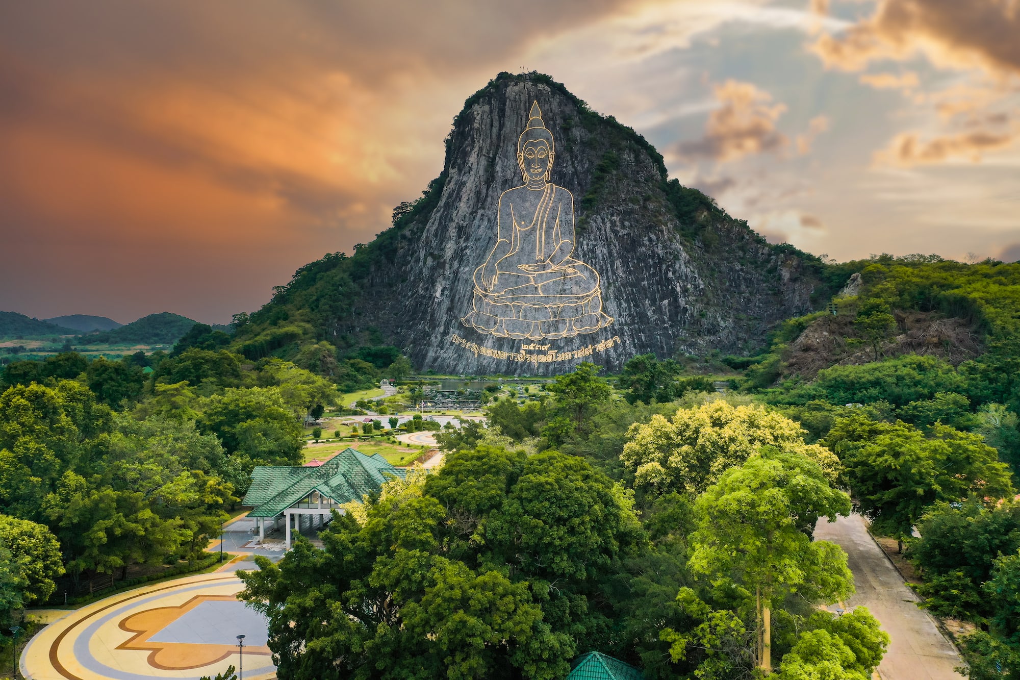 a mountain with a statue on it