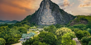 a mountain with a statue on it