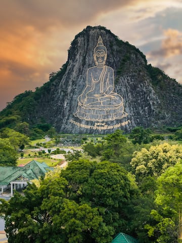 a mountain with a statue on it