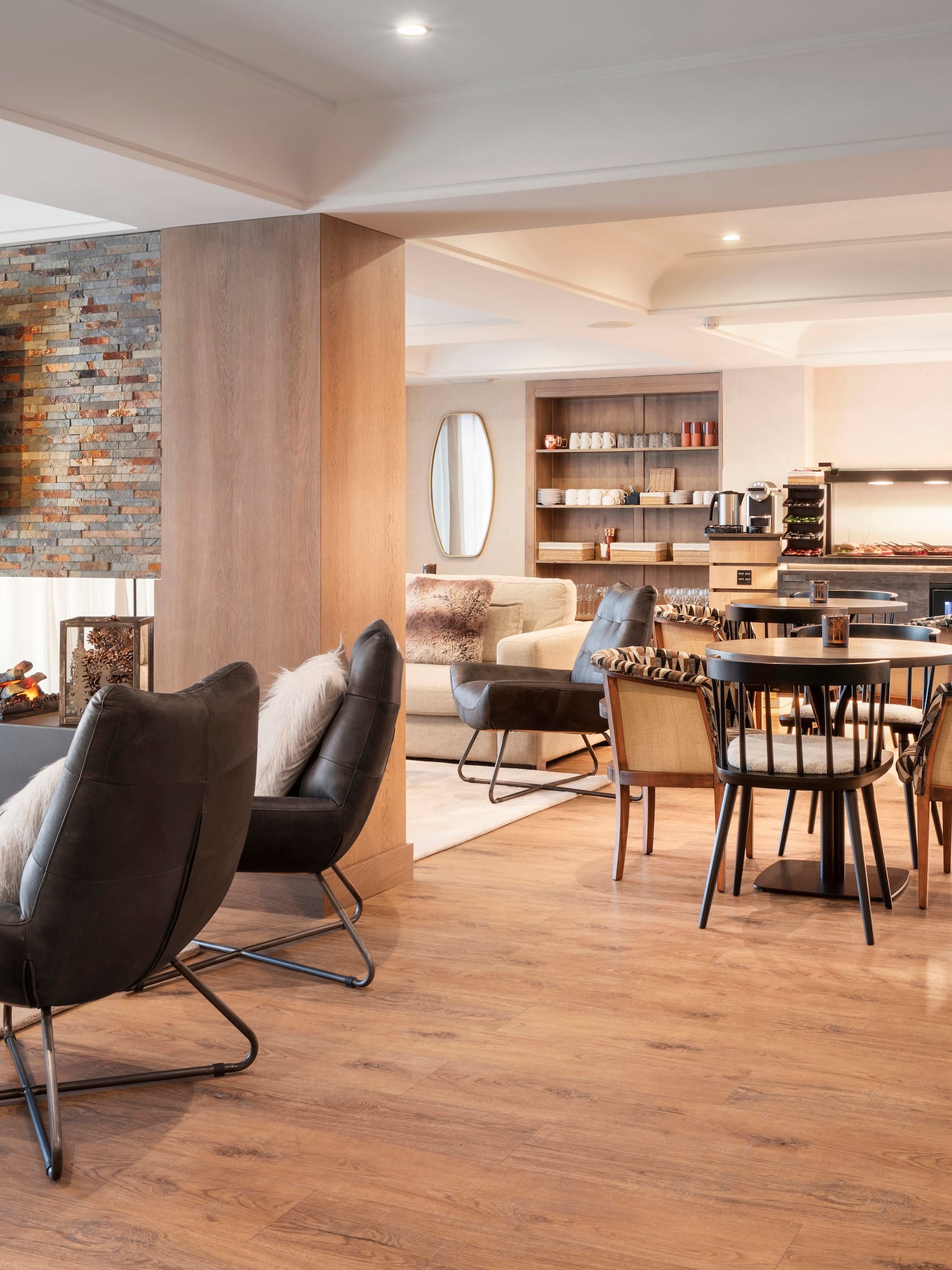 a room with a fireplace and chairs