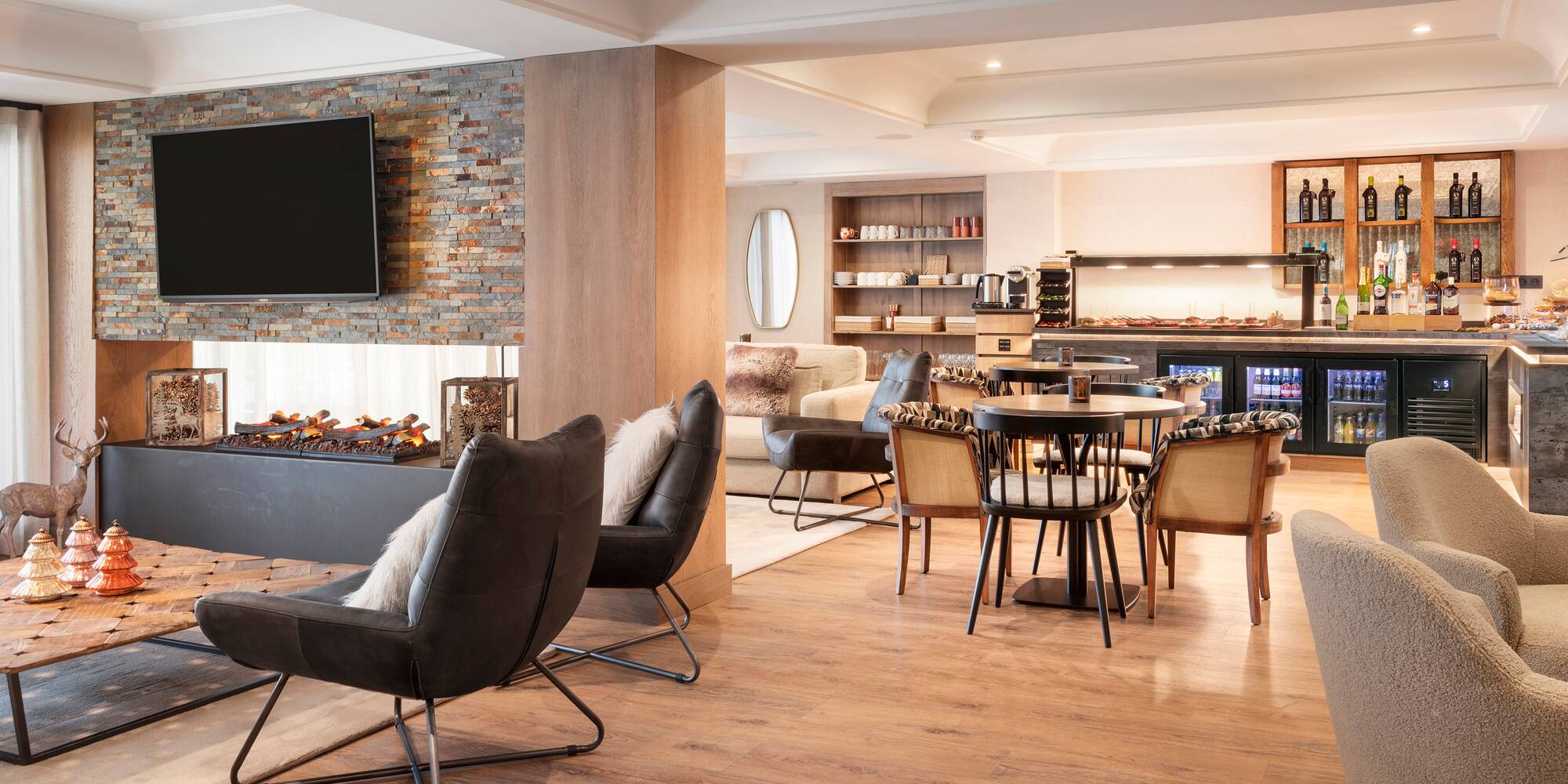 a room with a fireplace and chairs