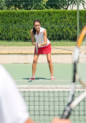 a woman holding a tennis racket