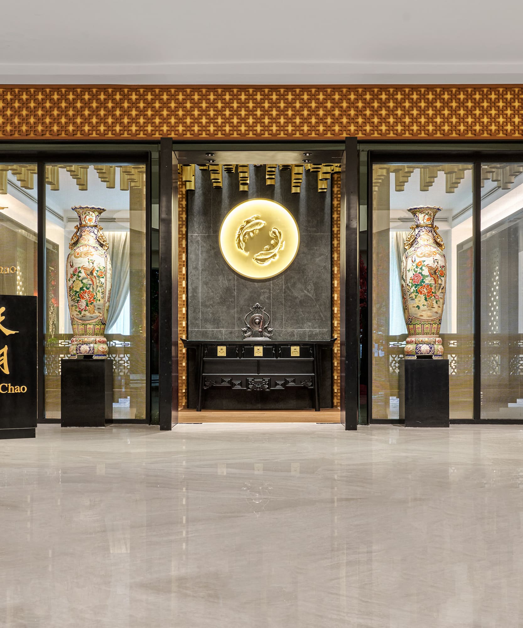 a building with glass walls and a sign