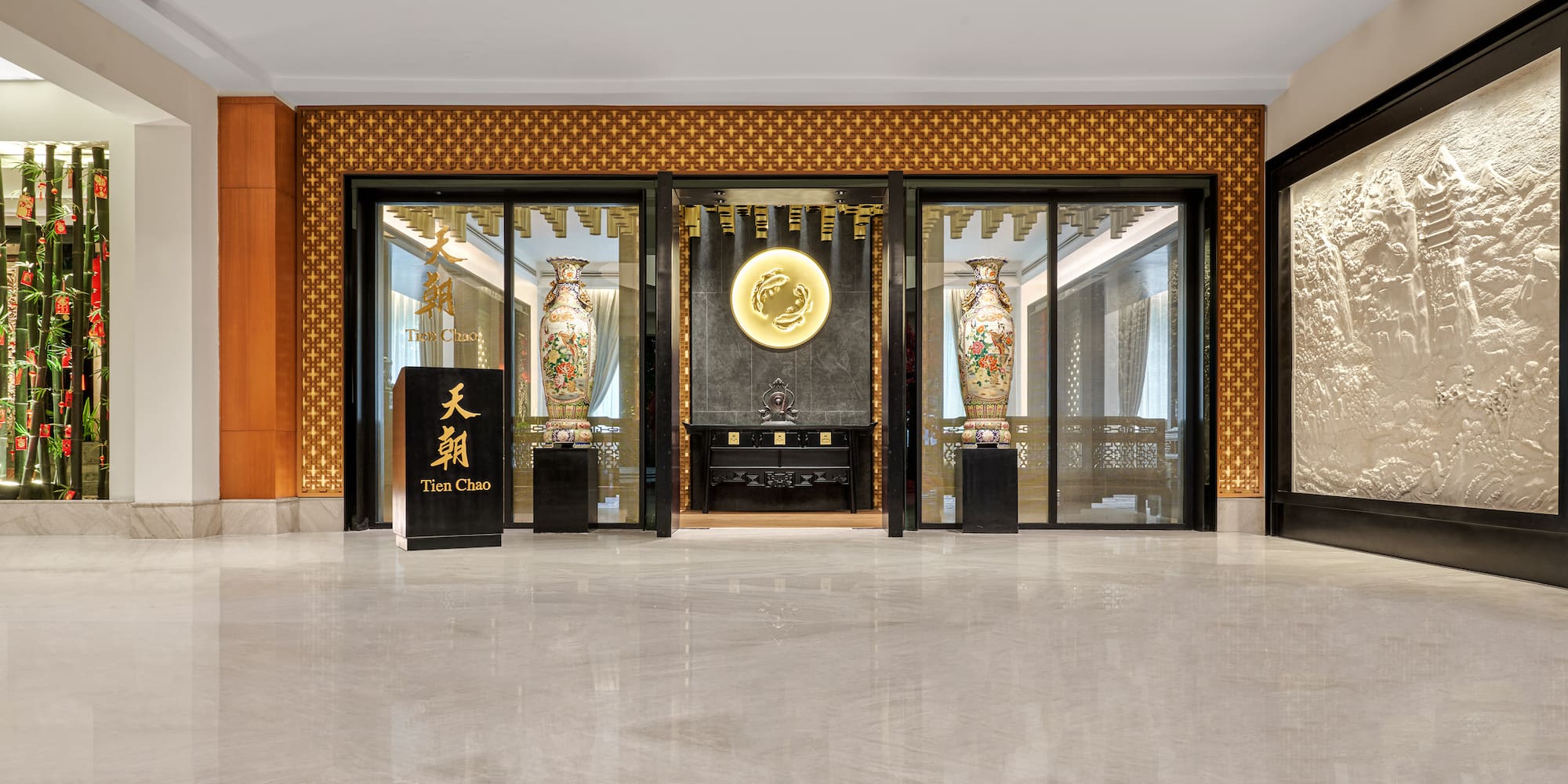 a building with glass walls and a sign