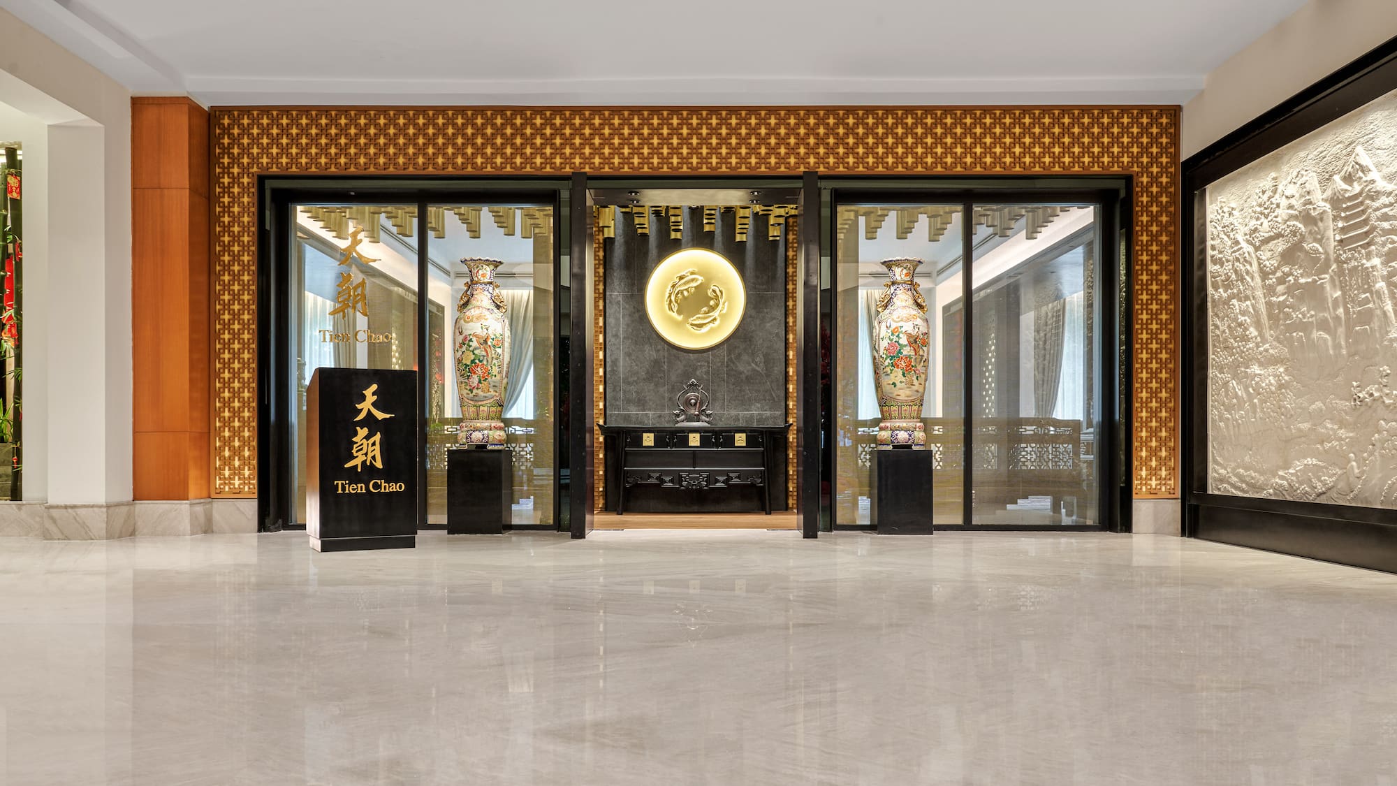 a building with glass walls and a sign