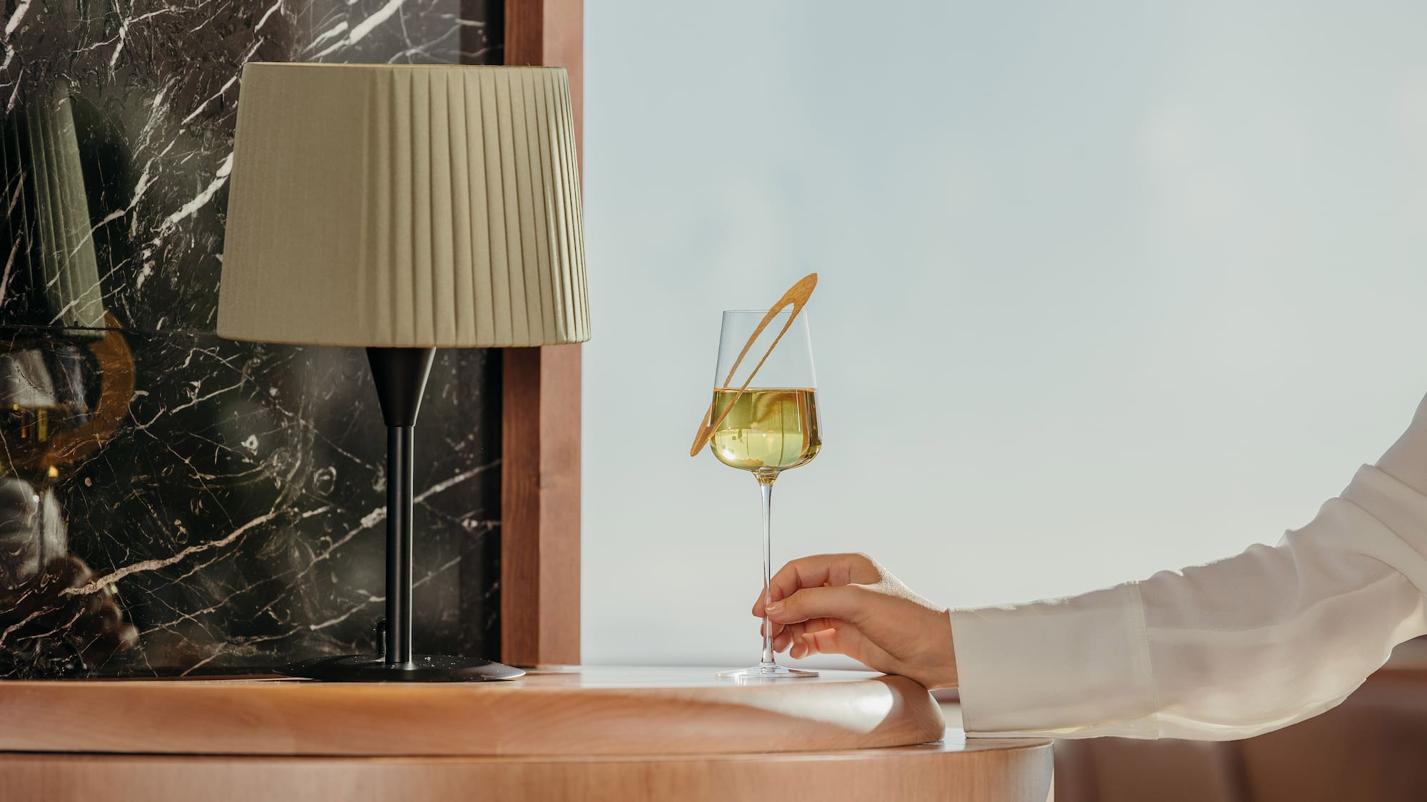 a person holding a glass of wine