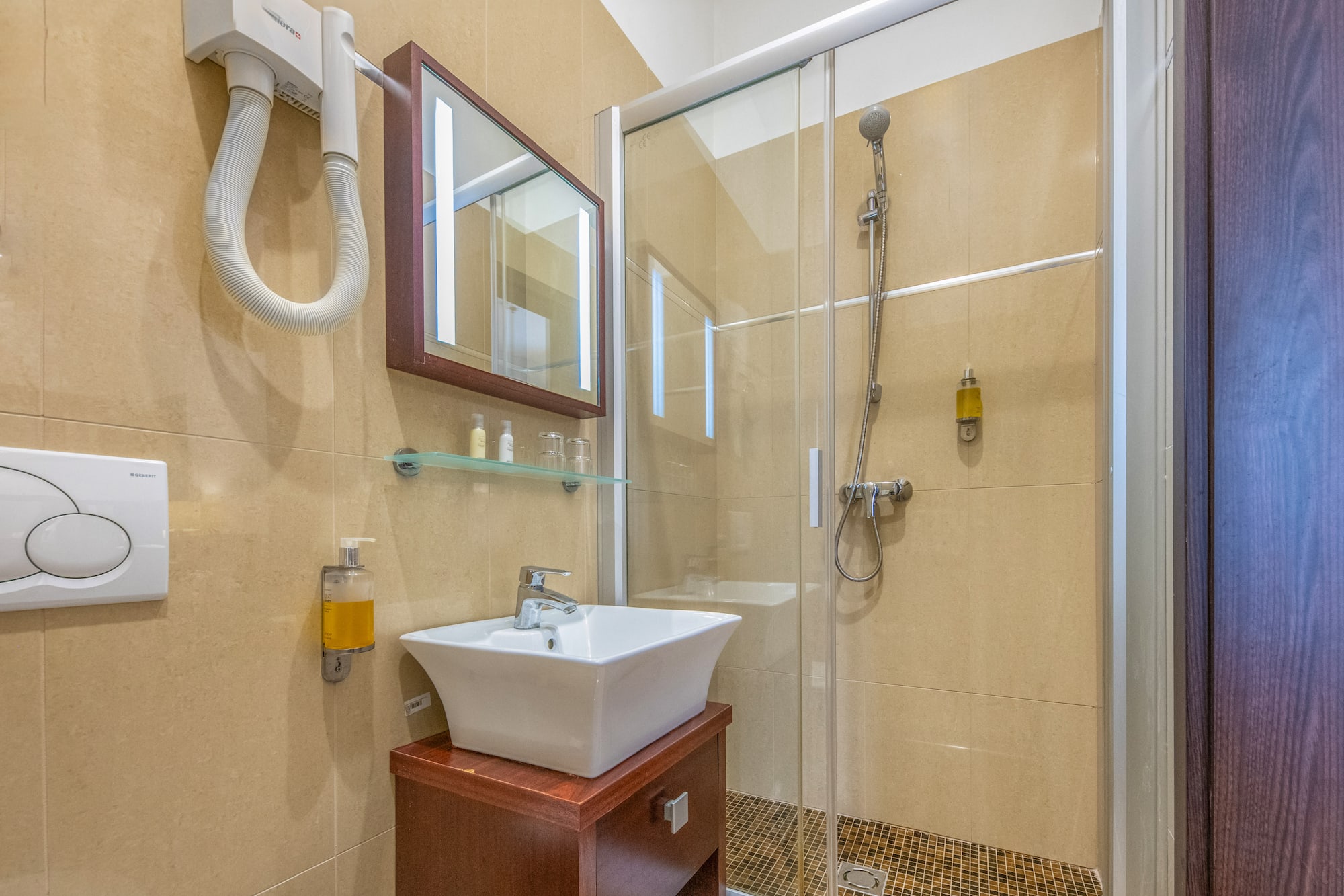 a bathroom with a shower and sink