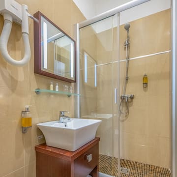 a bathroom with a shower and sink