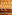 Illuminated wooden bar with liquor bottles on shelves, three stools, and rattan lights.