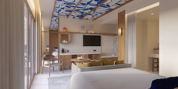 a room with a bed and a tv