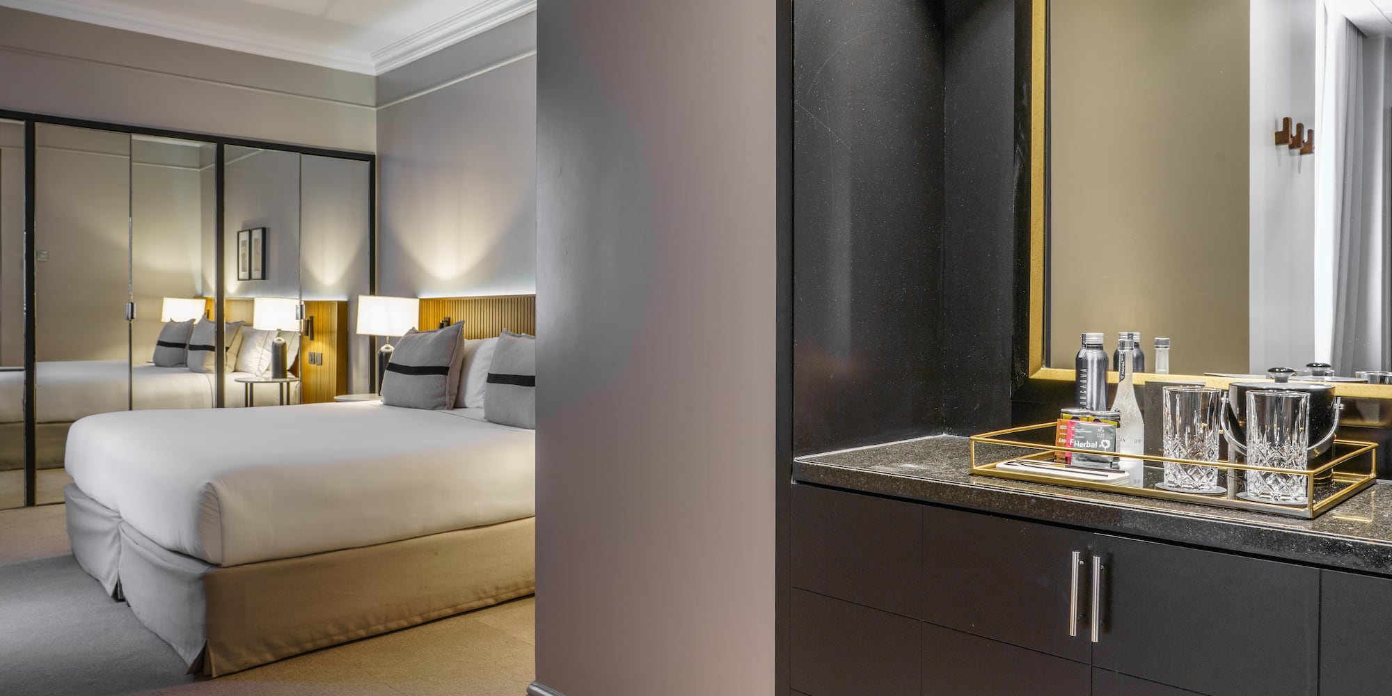 a bedroom with a mirror and a bed