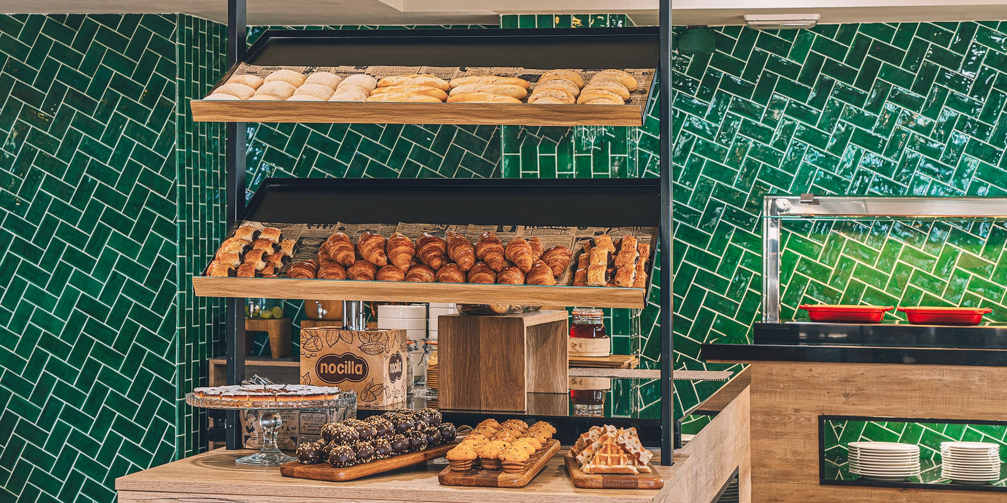 a bakery with many pastries on shelves