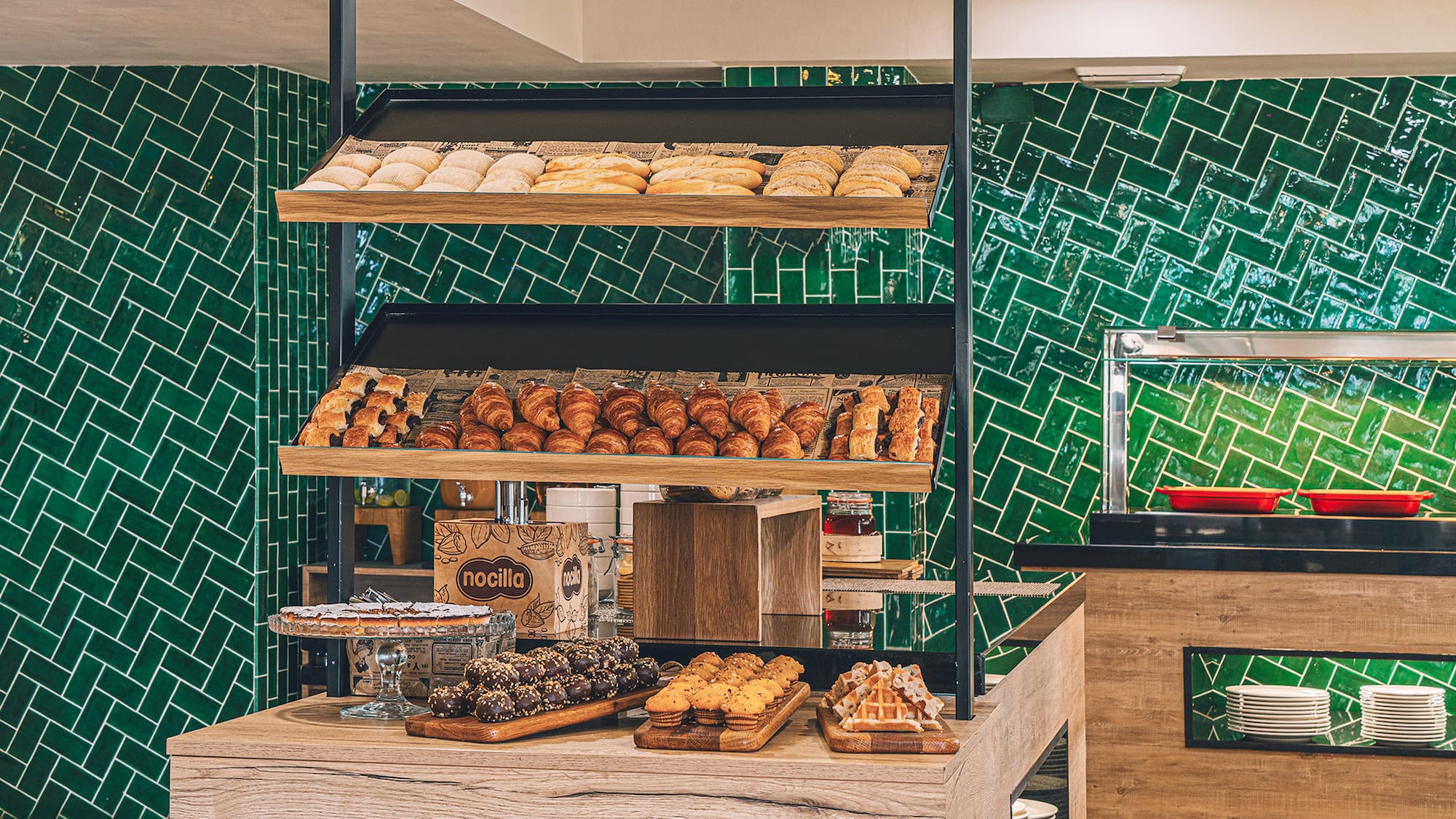 a bakery with many pastries on shelves