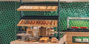 a bakery with many pastries on shelves