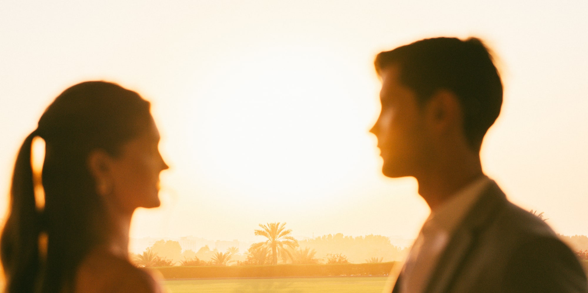 a man and woman holding wine glasses