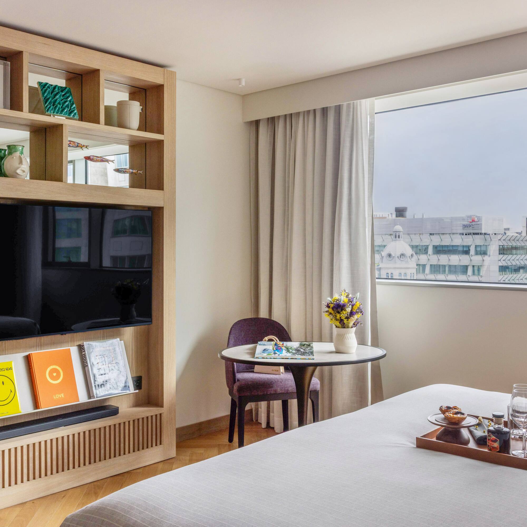 a room with a bed and a tv