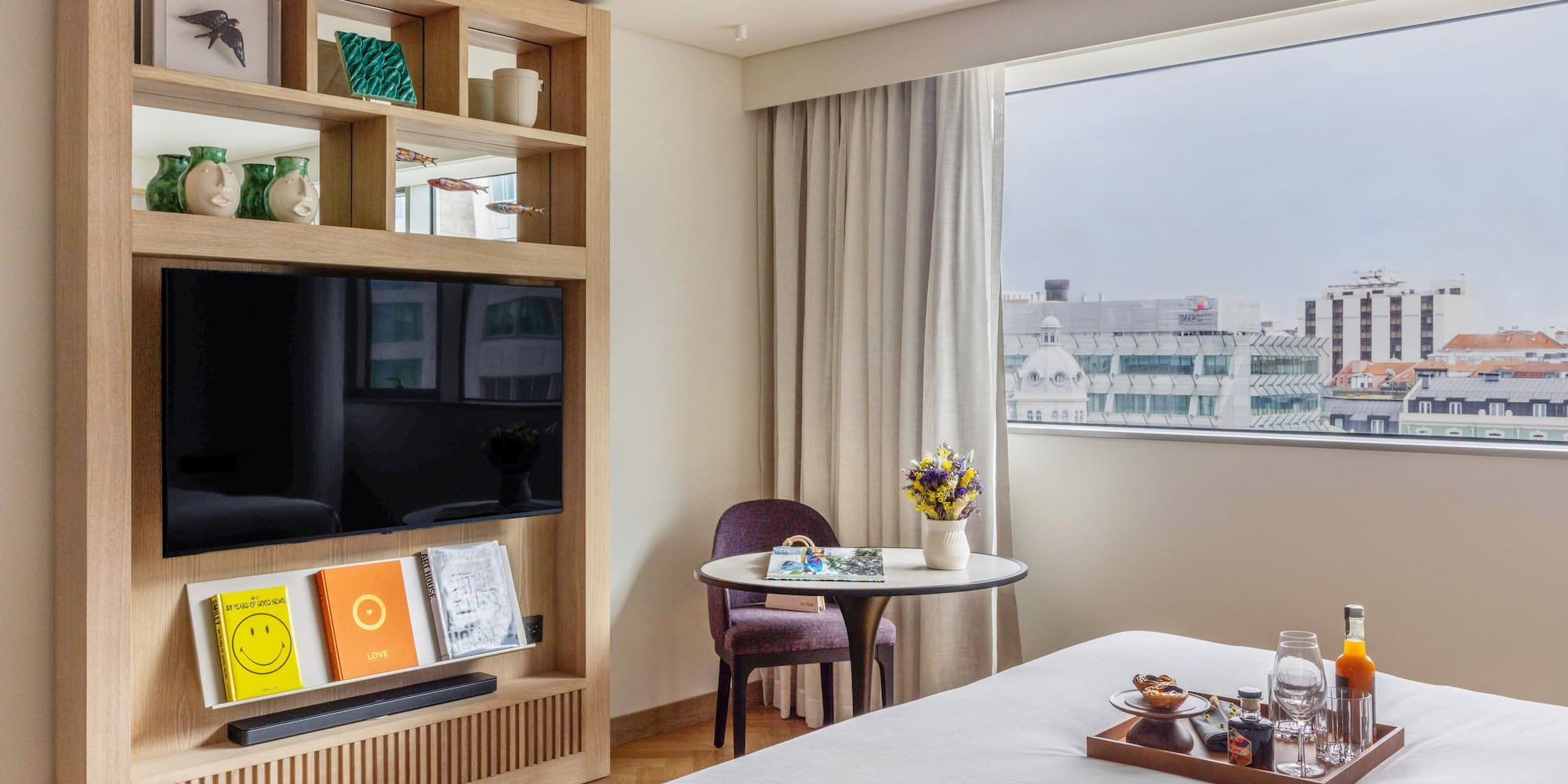 a room with a bed and a tv