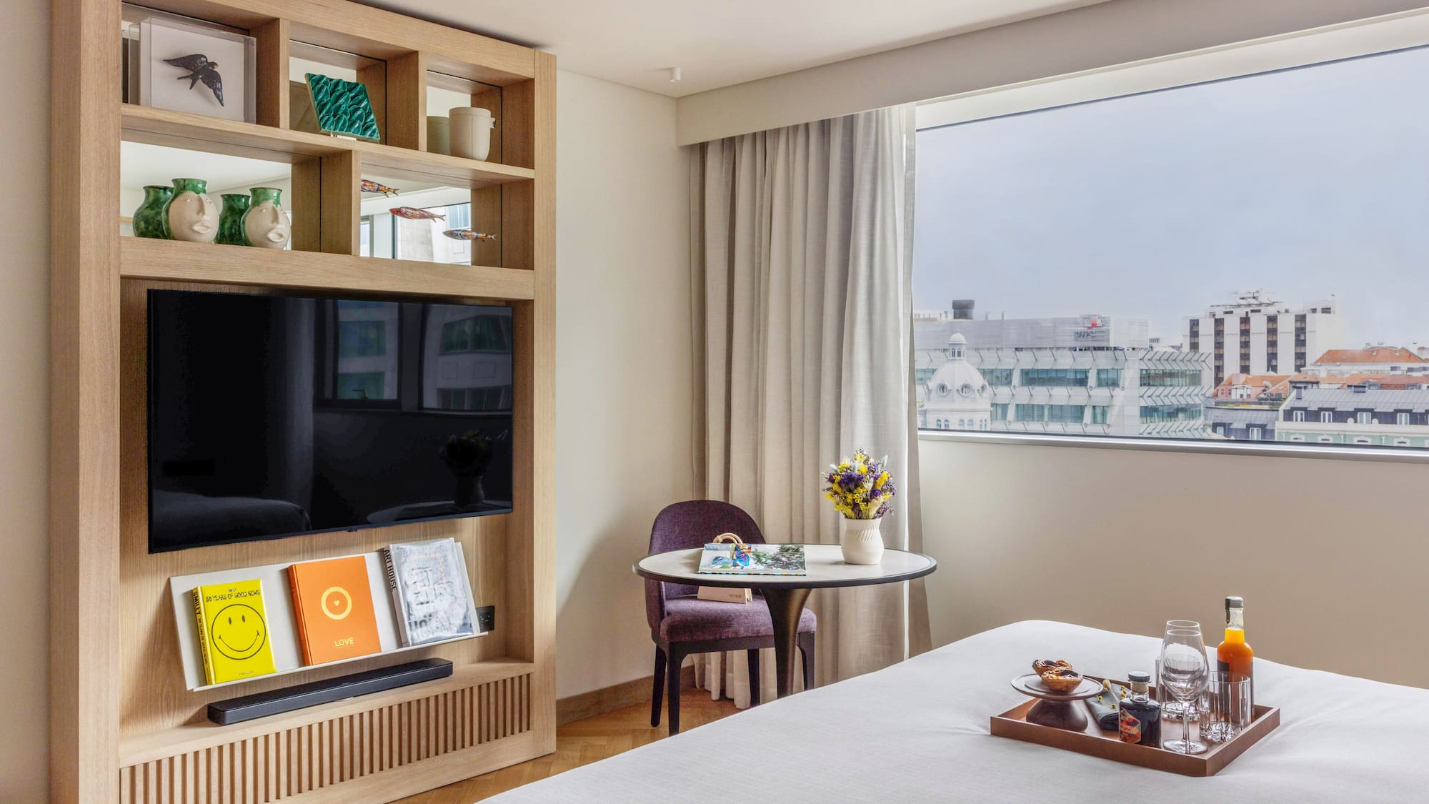 a room with a bed and a tv