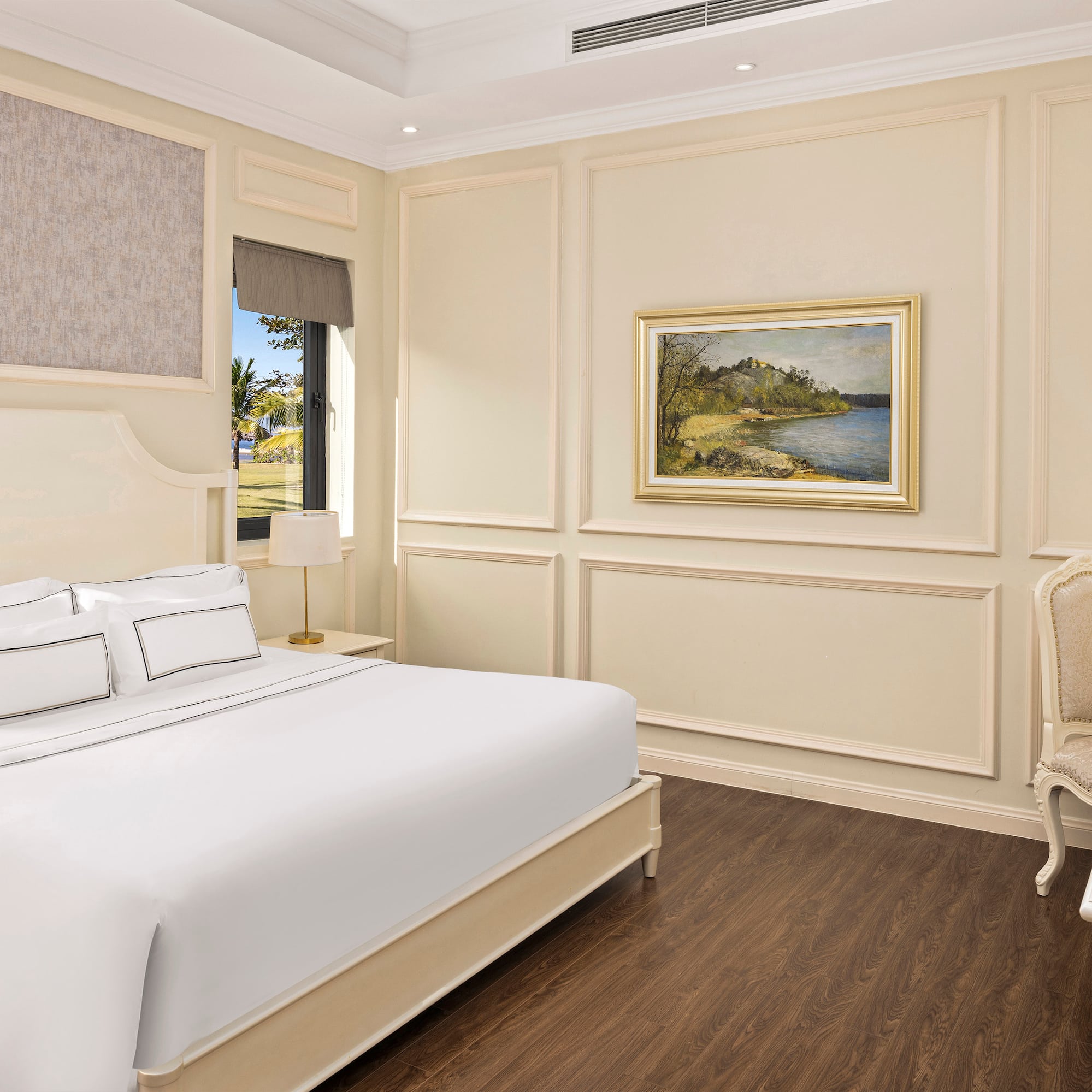 a bedroom with a bed and a chair