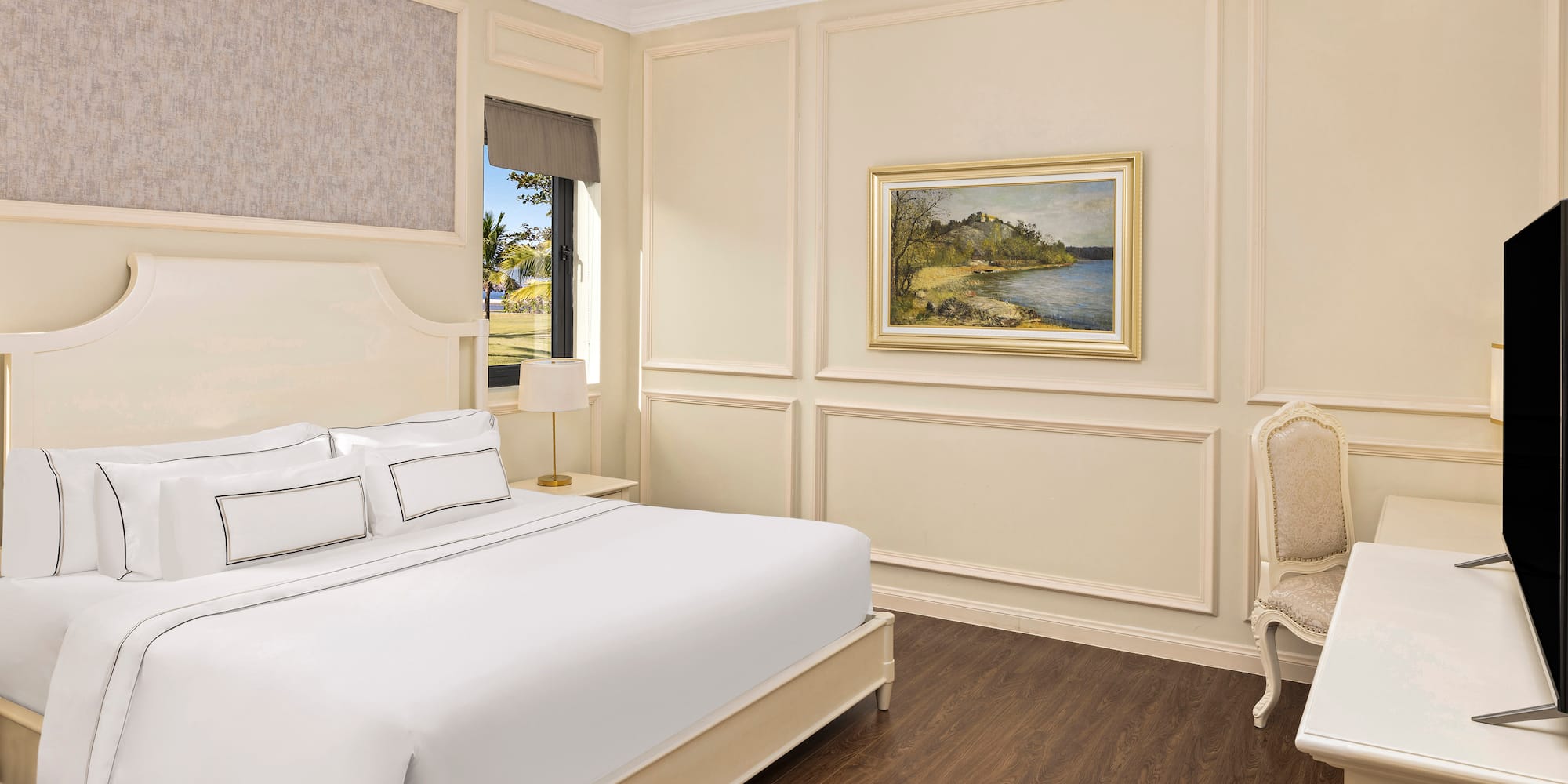 a bedroom with a bed and a chair