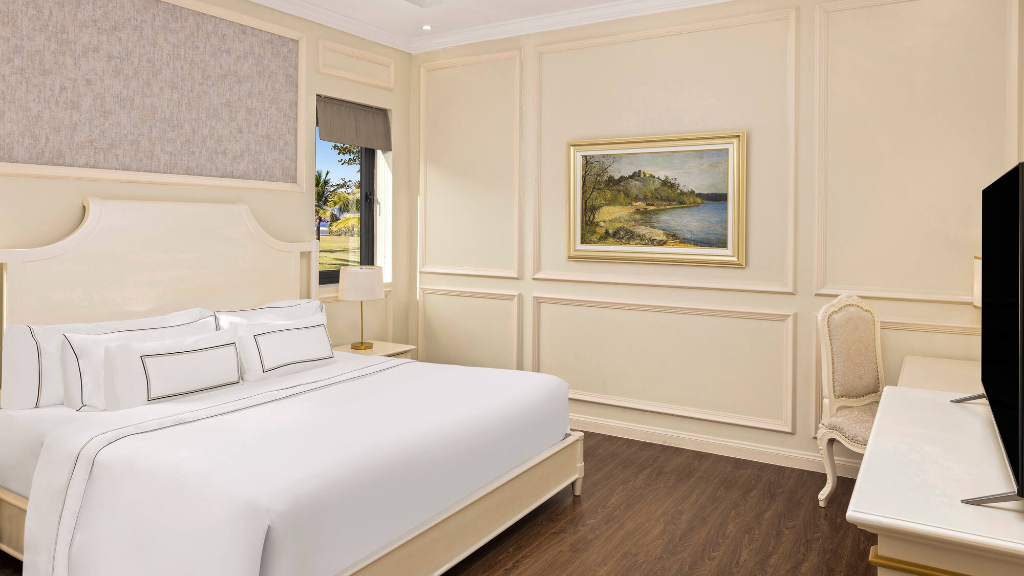 a bedroom with a bed and a chair