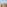 Tropical ocean view balcony with beach, blue sea, palm trees, and palapas.