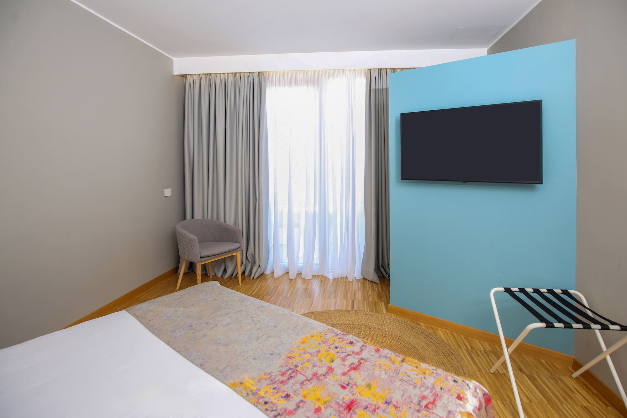 a room with a bed and a tv