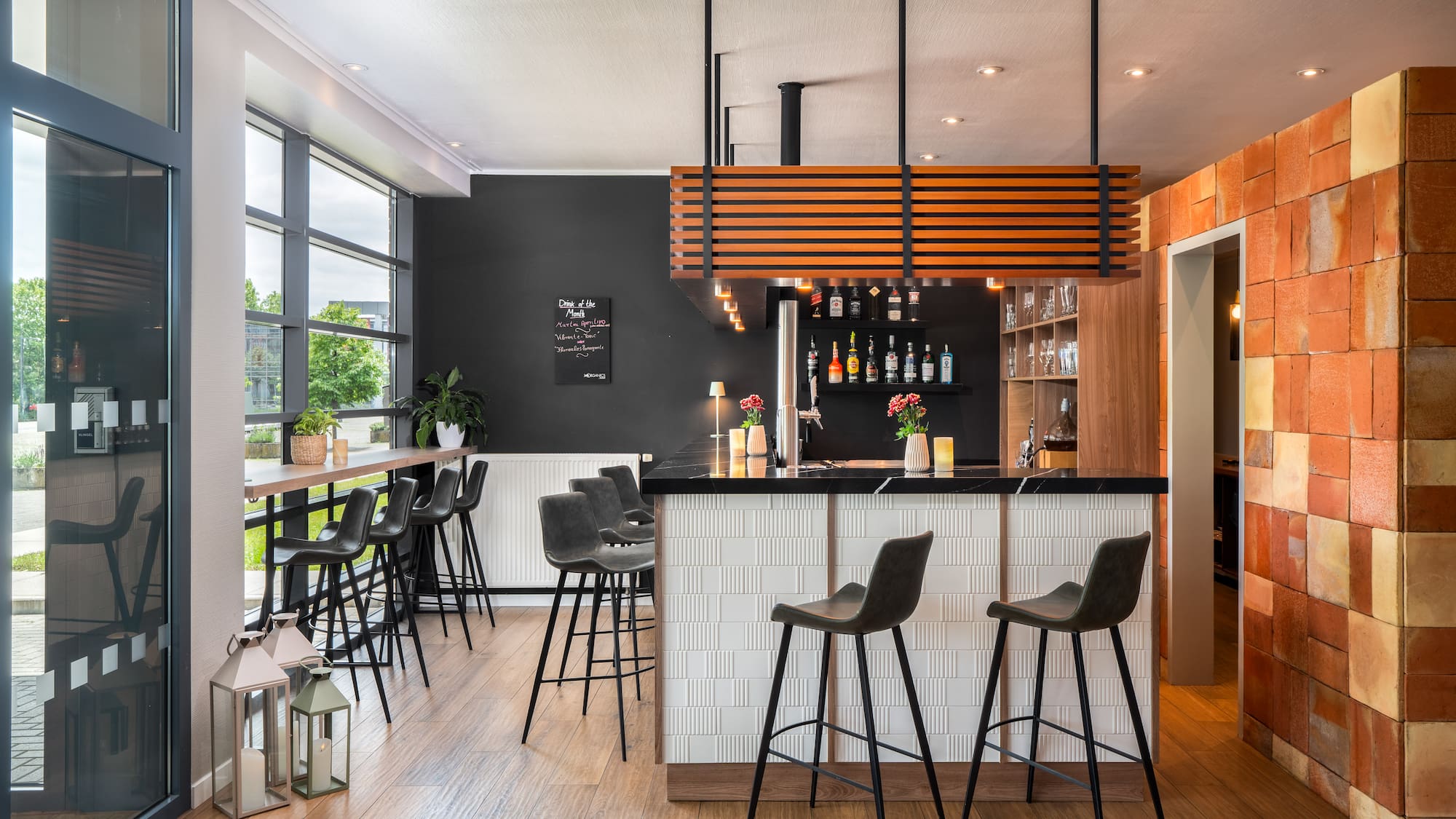 a bar with stools and a wood floor