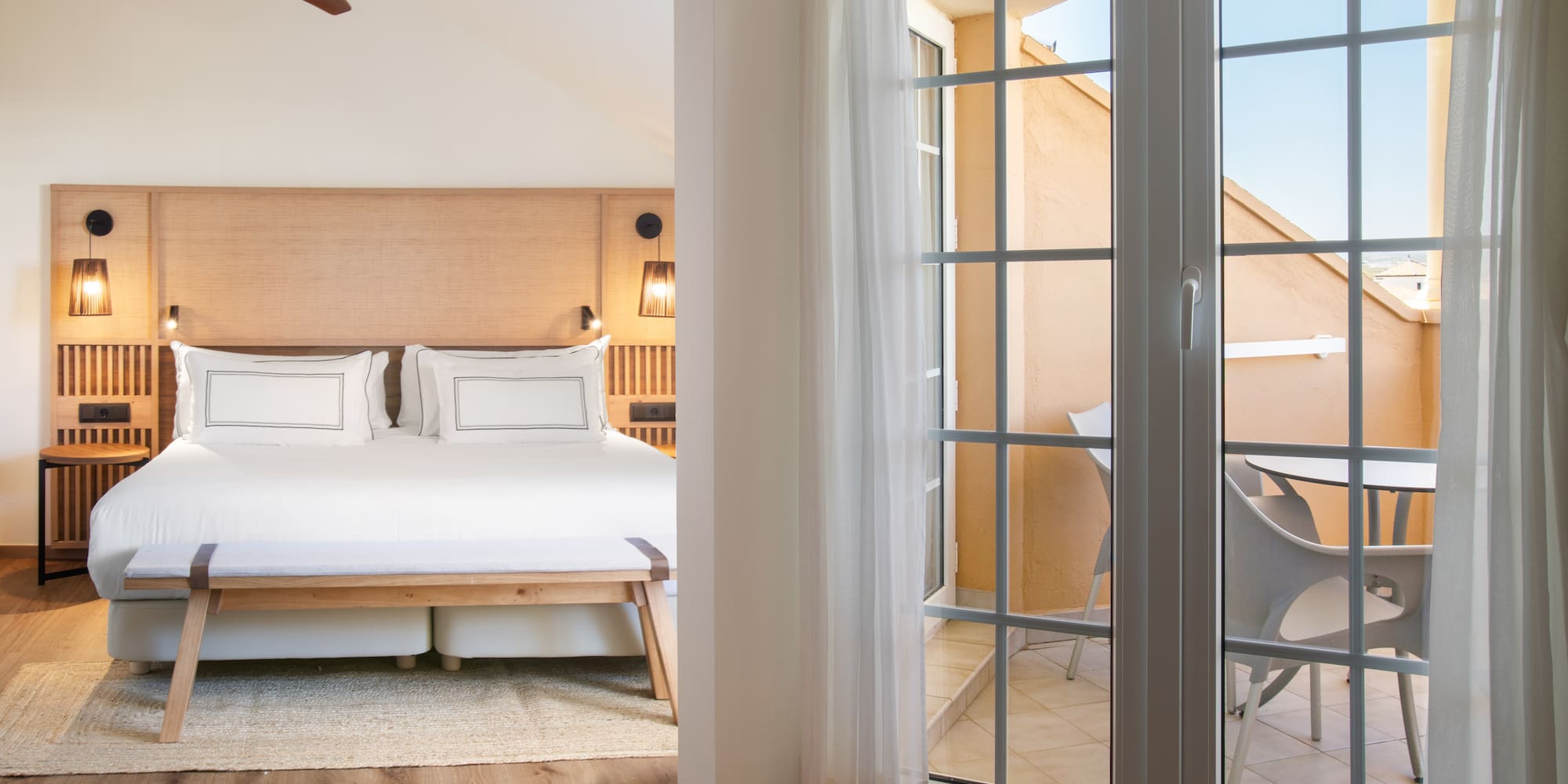 a bedroom with a bed and a sliding glass door