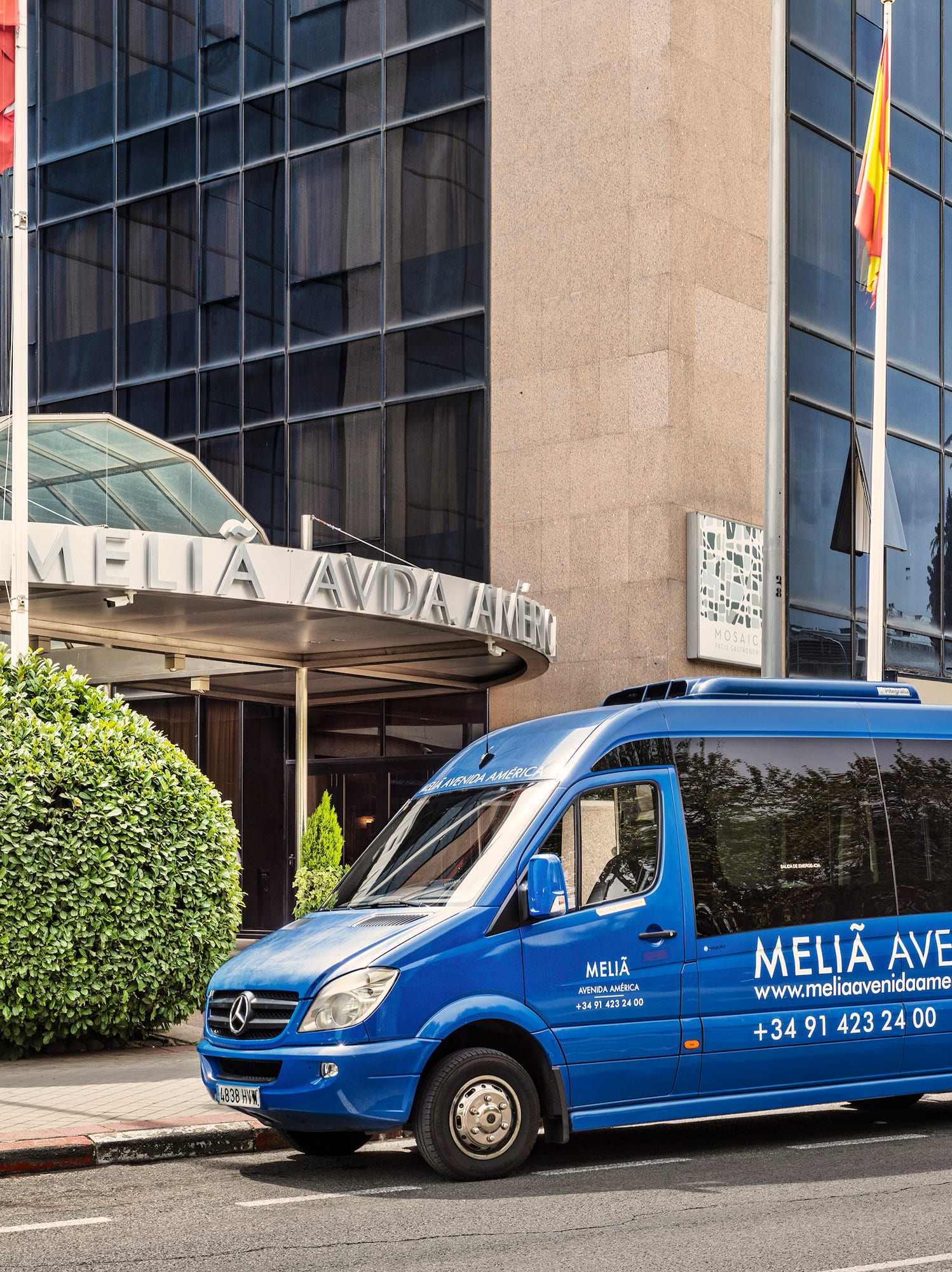 a blue van parked on the side of a road
