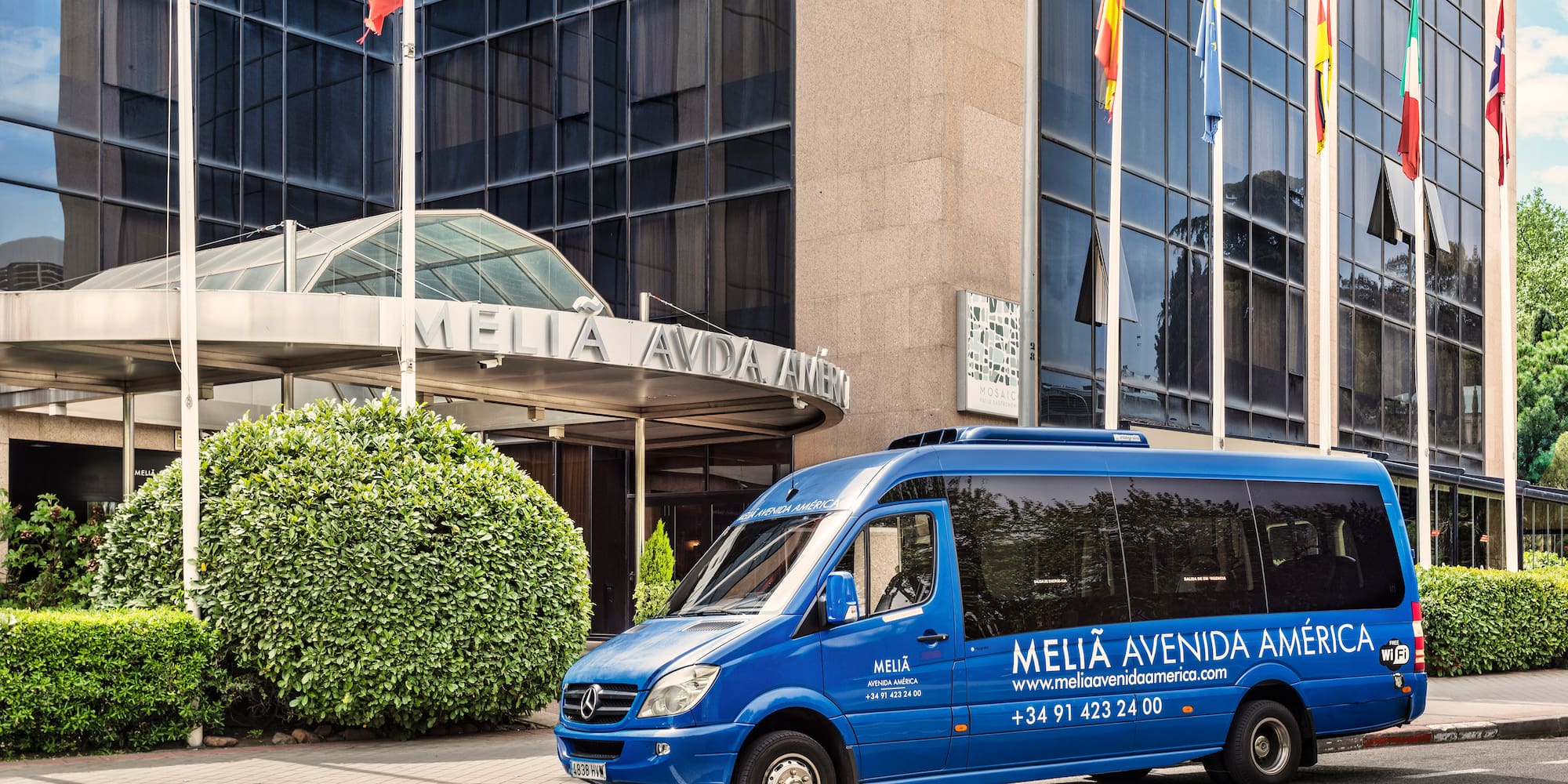 a blue van parked on the side of a street
