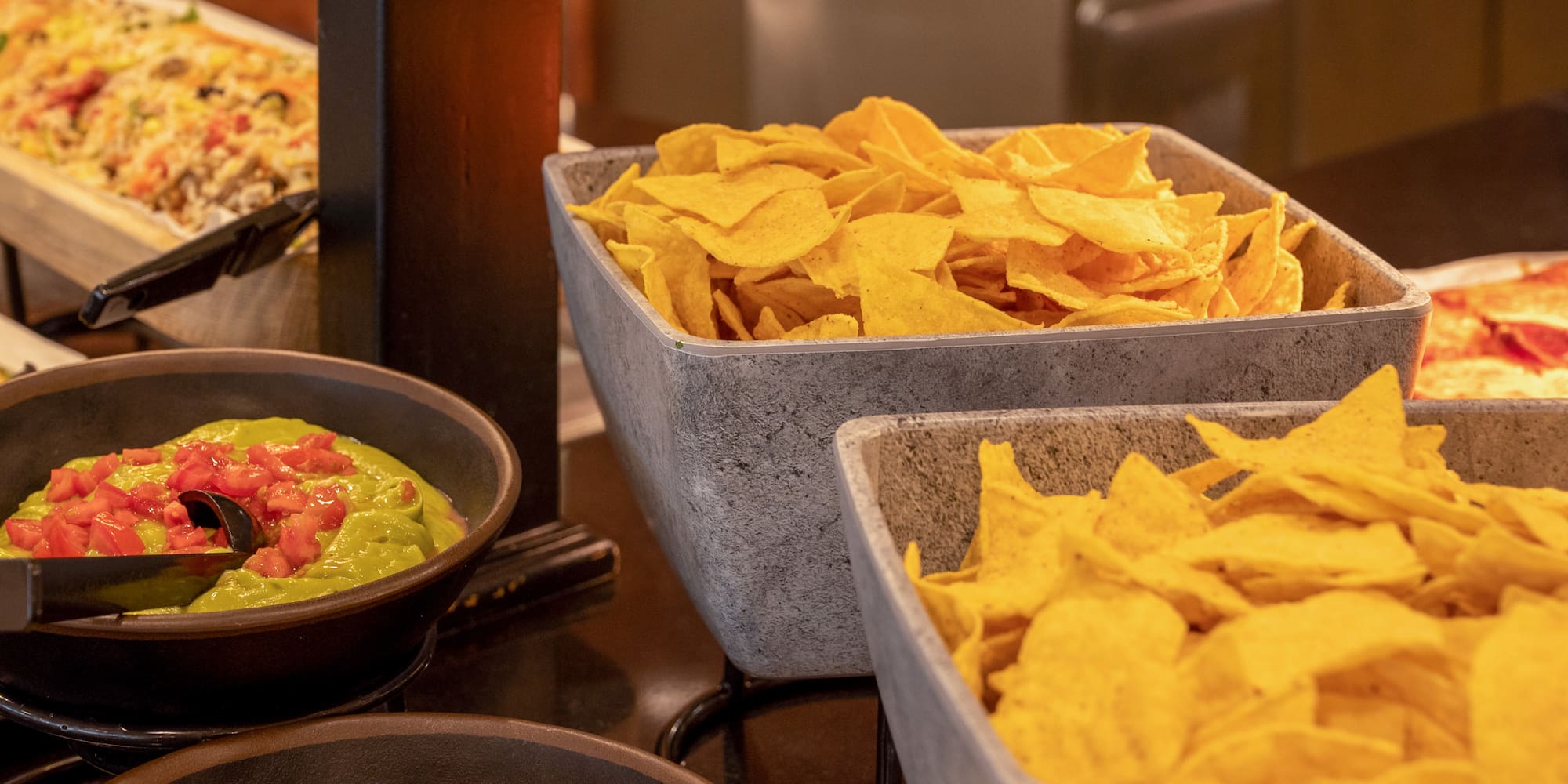bowls of chips and dips in bowls