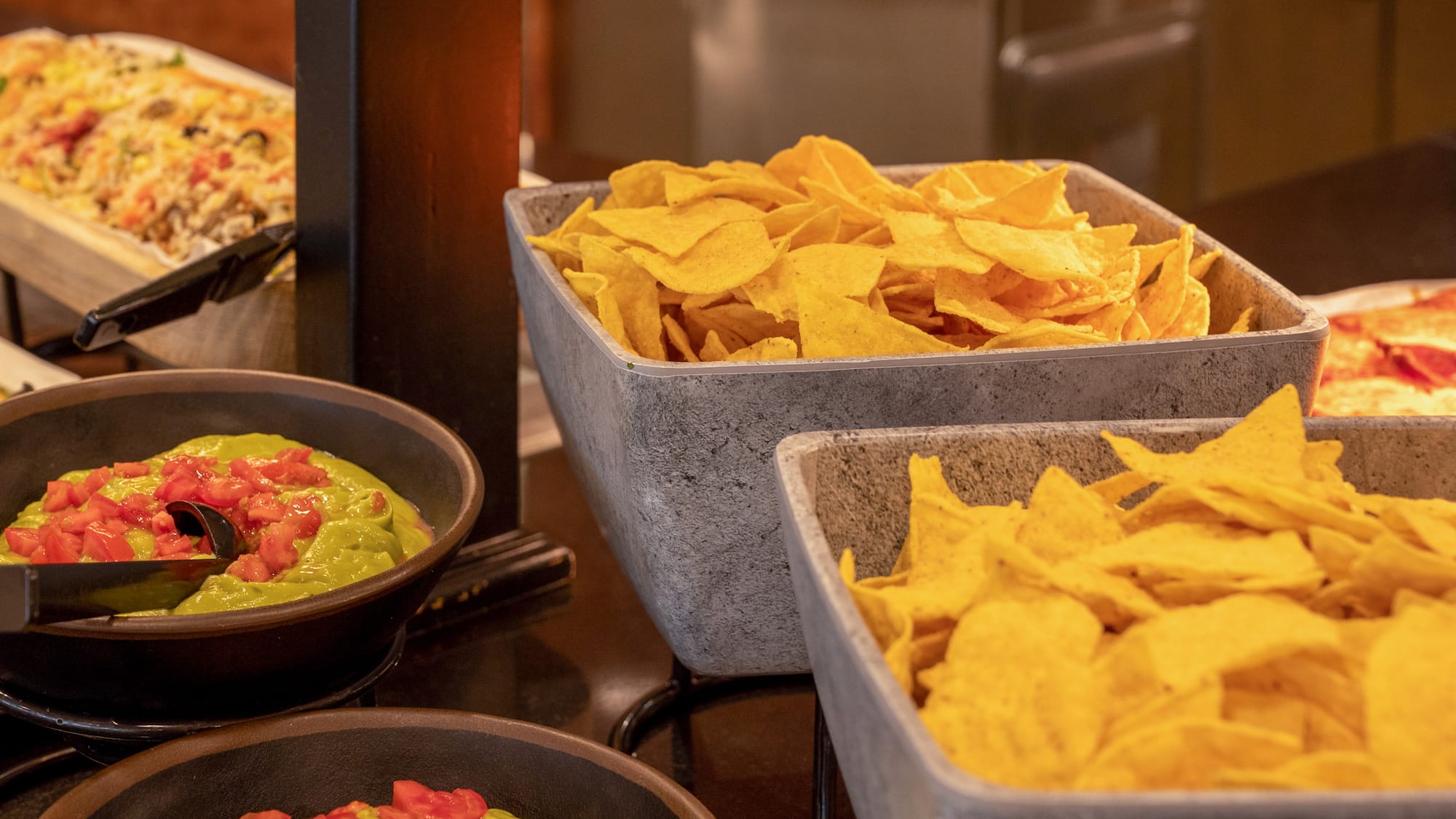 bowls of chips and dips in bowls