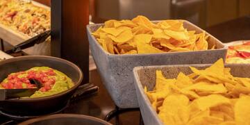 bowls of chips and dips in bowls