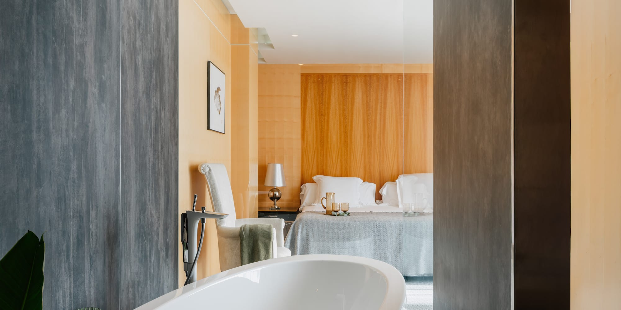 a bathroom with a bed and a bathtub