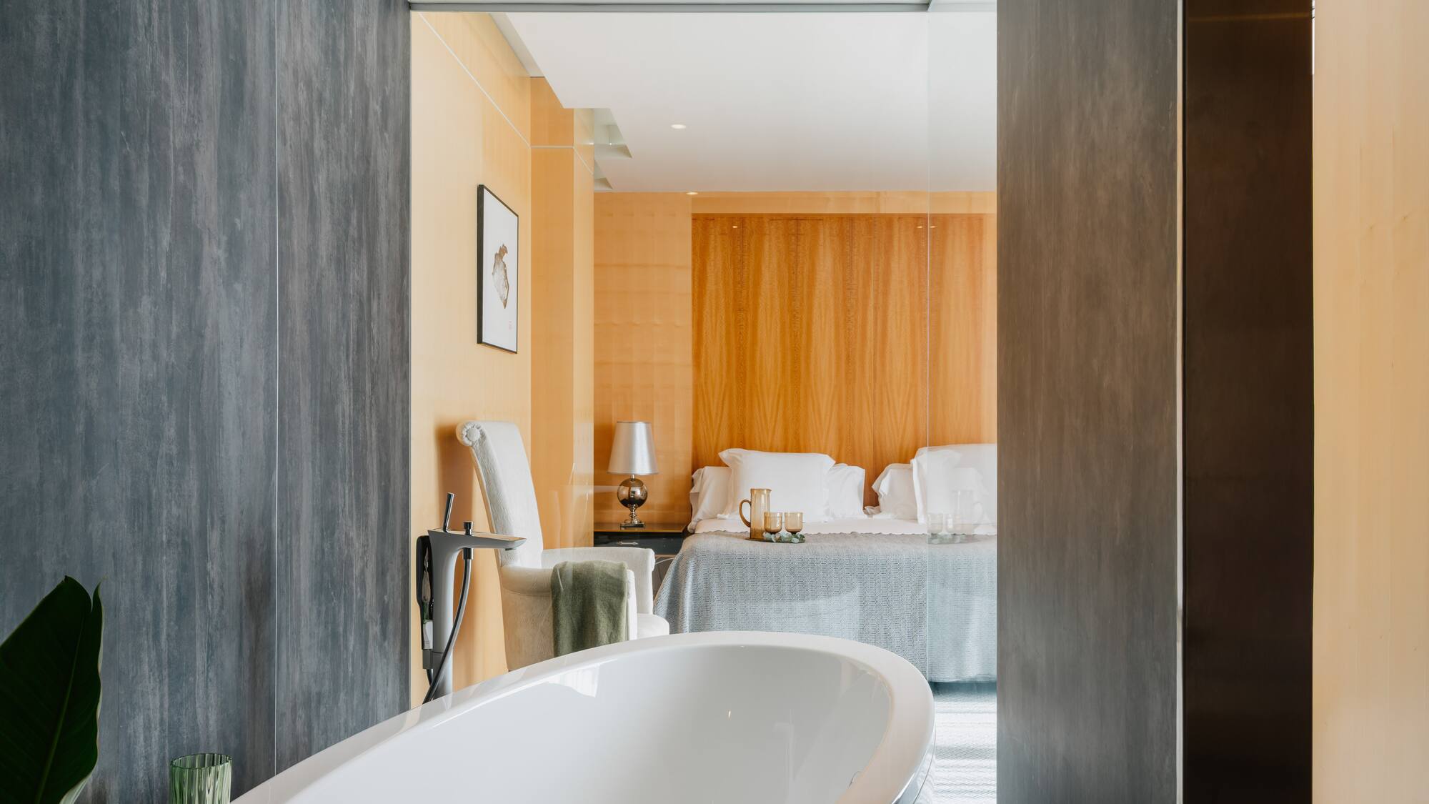 a bathroom with a bed and a bathtub