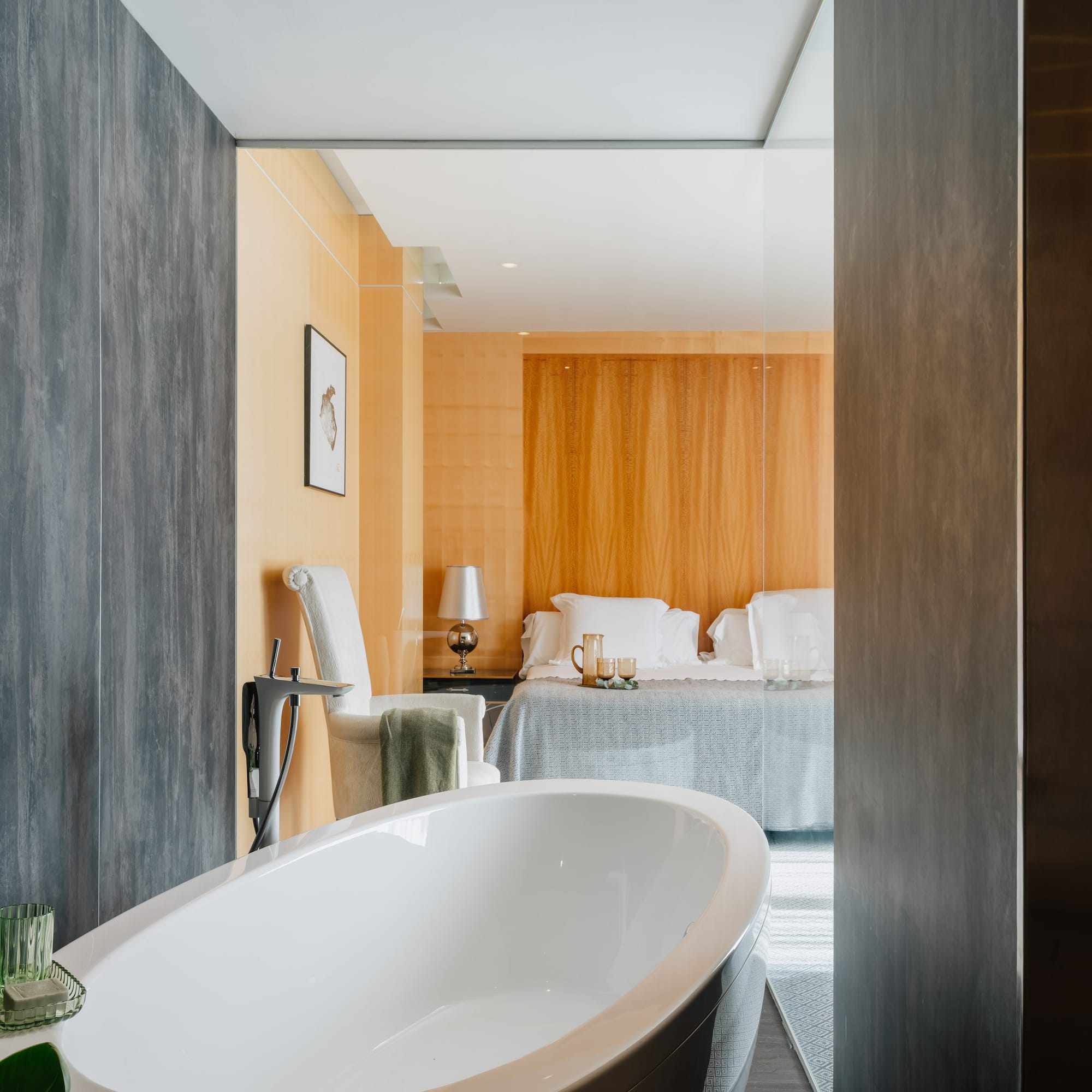 a bathroom with a bed and a bathtub