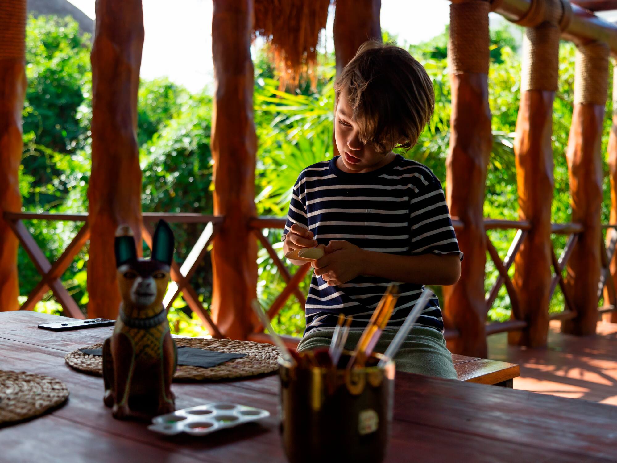 a boy playing with a toy