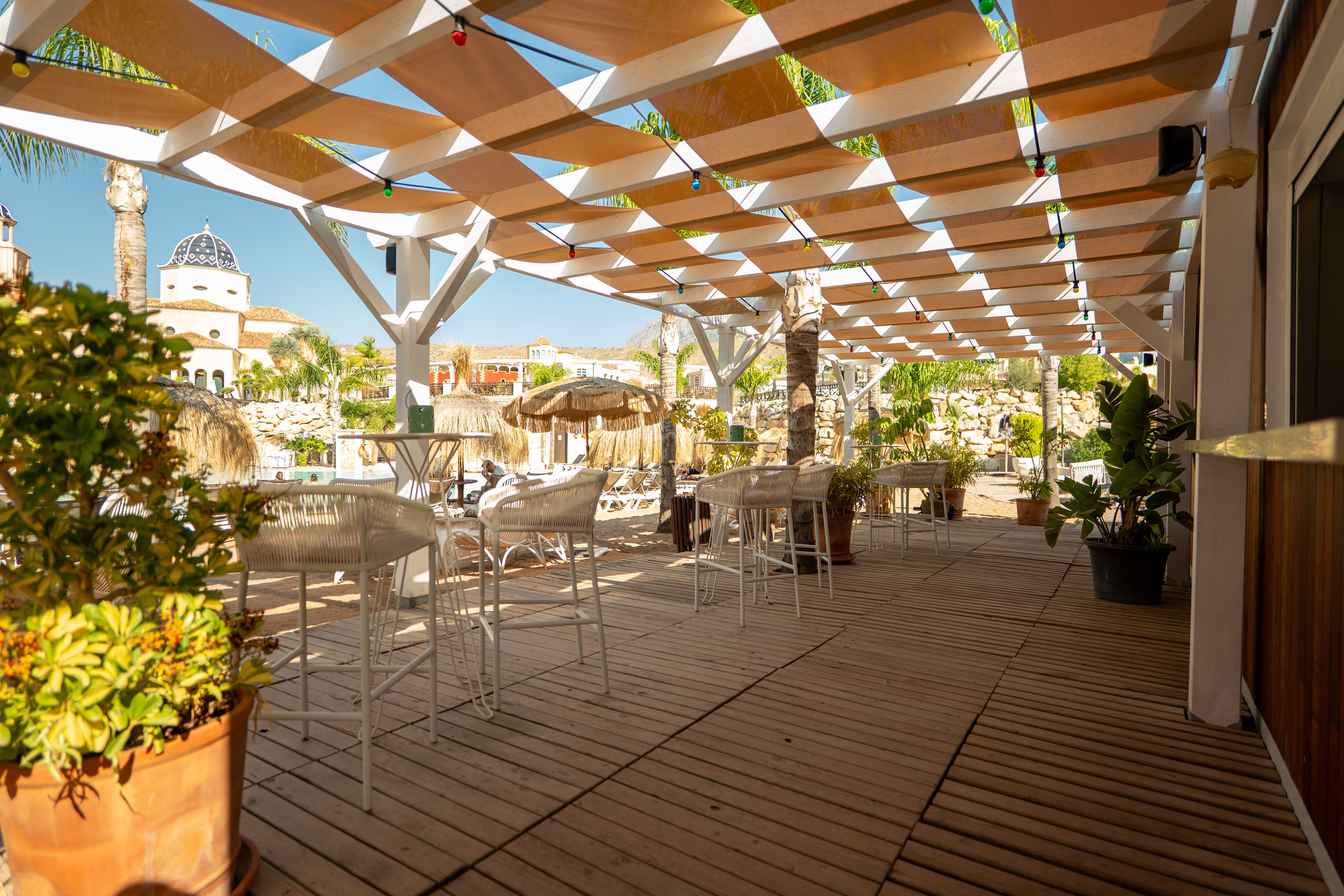 a patio with tables and chairs