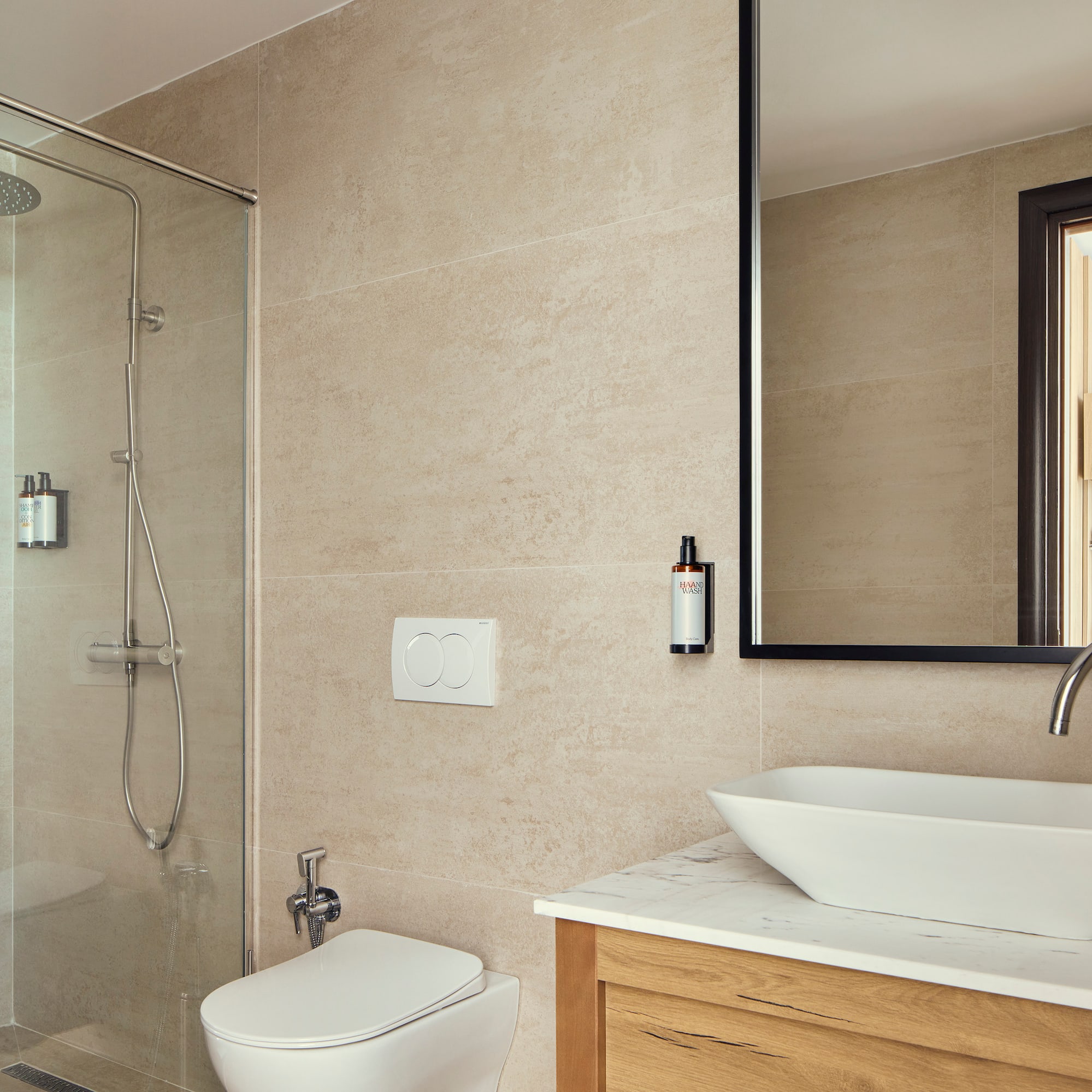 a bathroom with a glass shower and sink