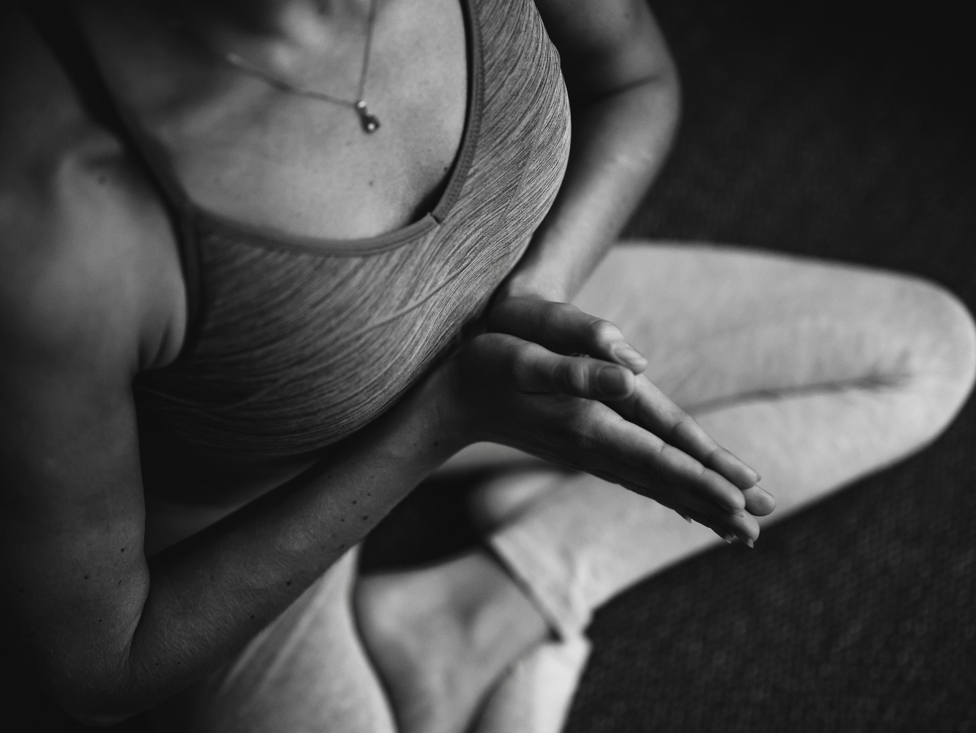 a person sitting in a yoga pose