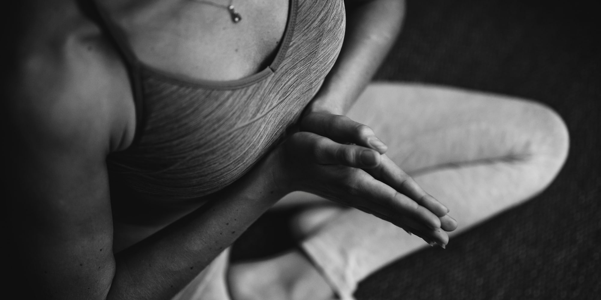 a person sitting in a yoga pose