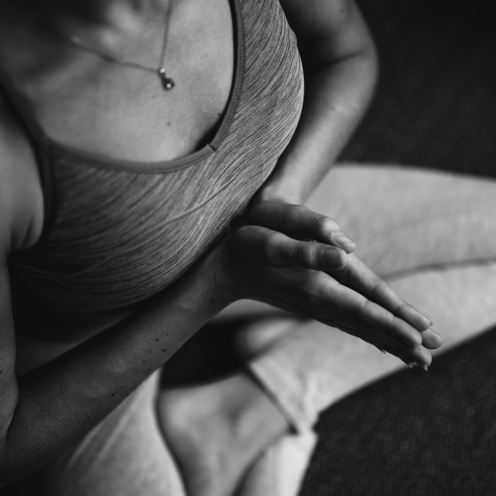 a person sitting in a yoga pose