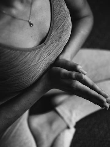 a person sitting in a yoga pose