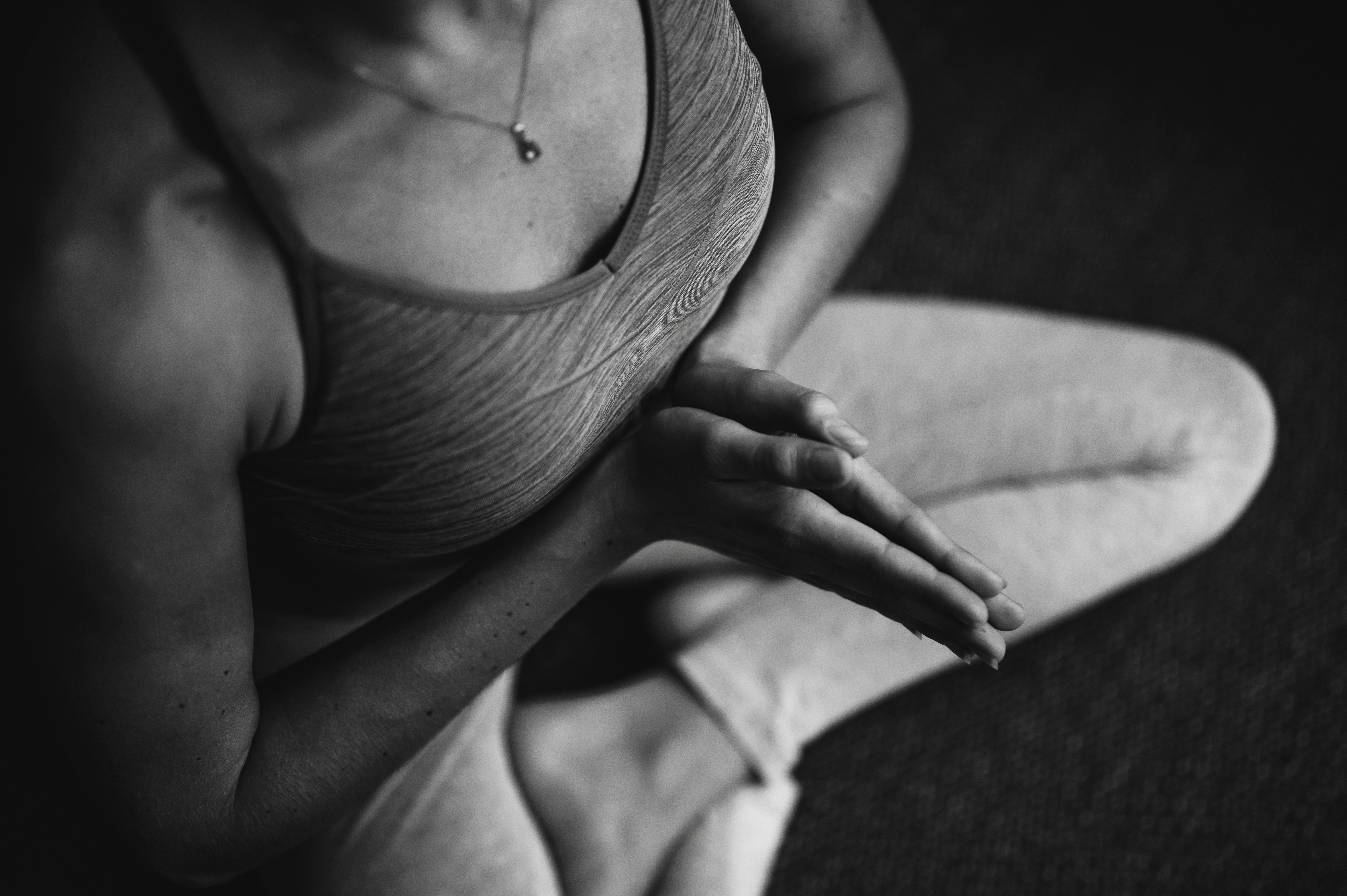 a person sitting in a yoga pose