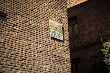 a sign on a brick wall