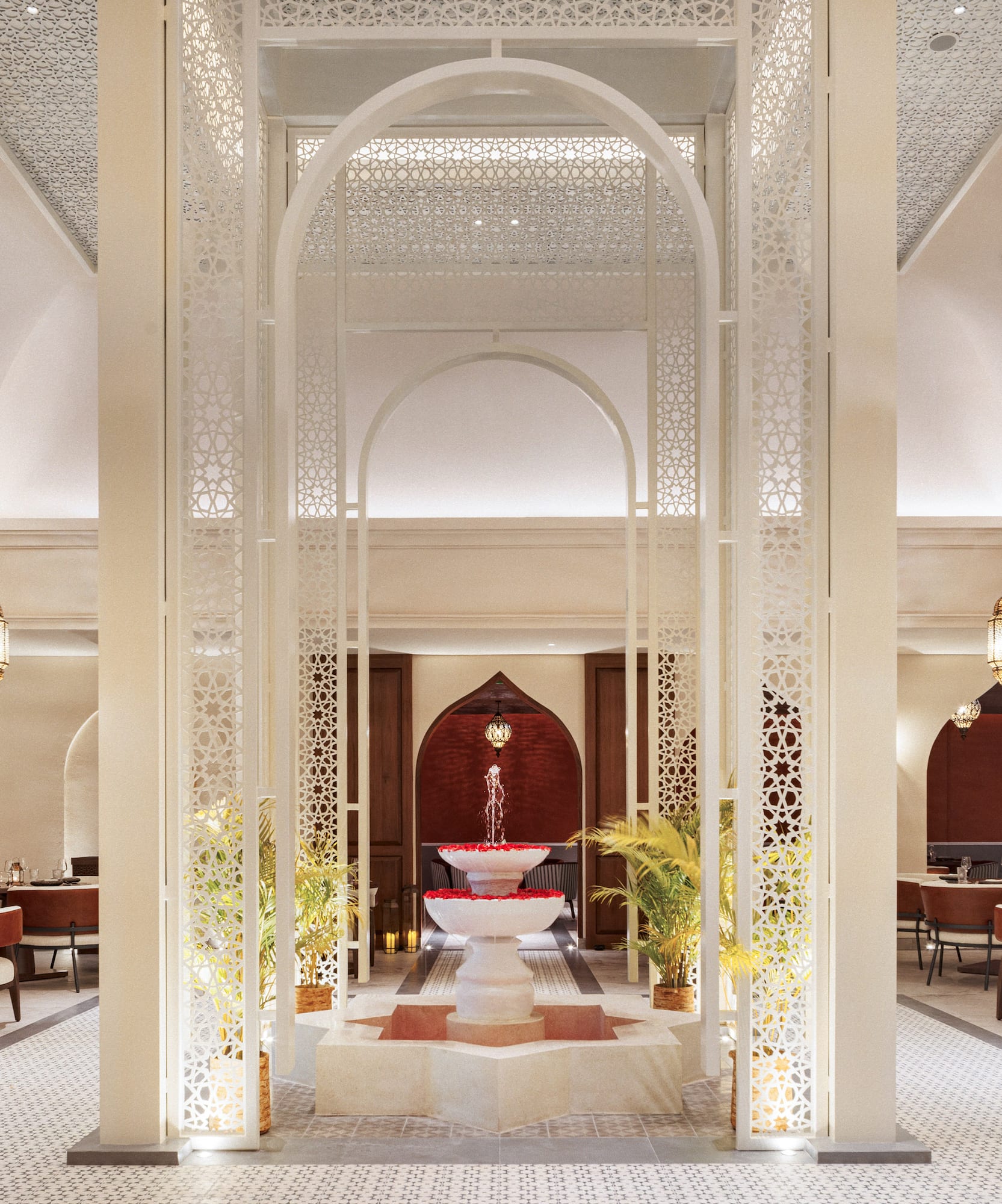 a room with a fountain and tables