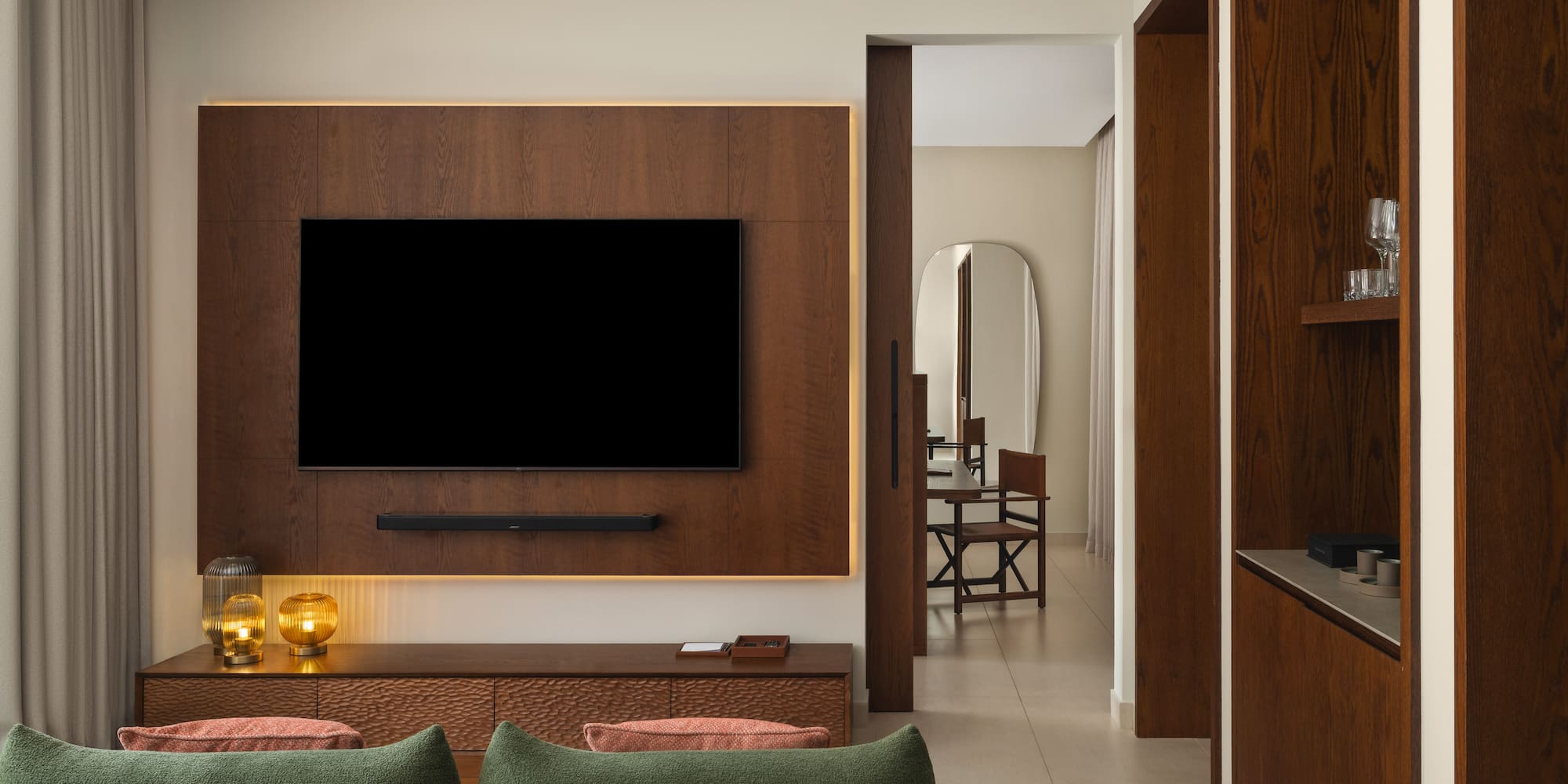 a living room with a tv on the wall